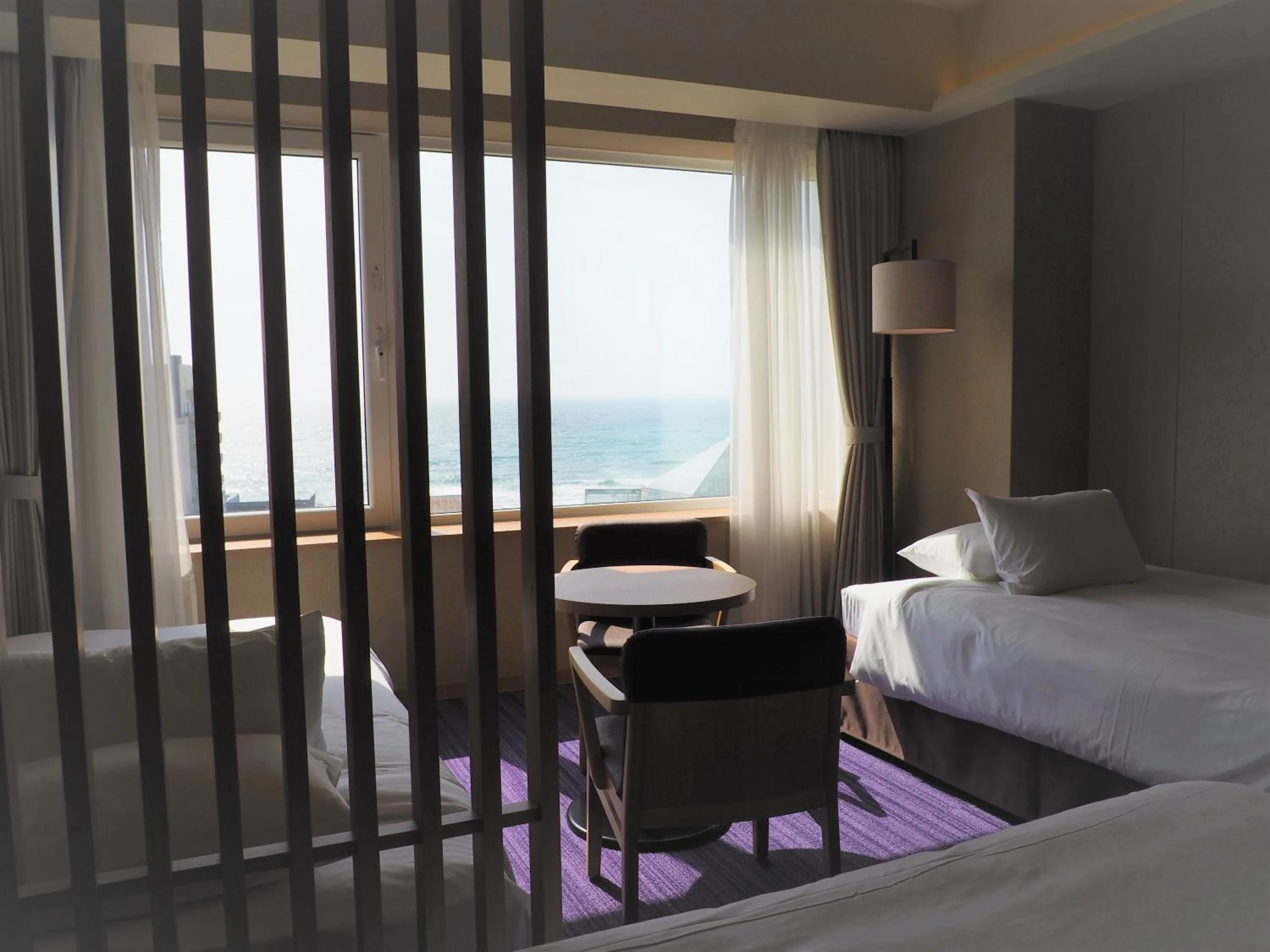 View (from property/room), Bed in Hakodate Yunokawa Onsen Umi to Akari Hewitt Resort