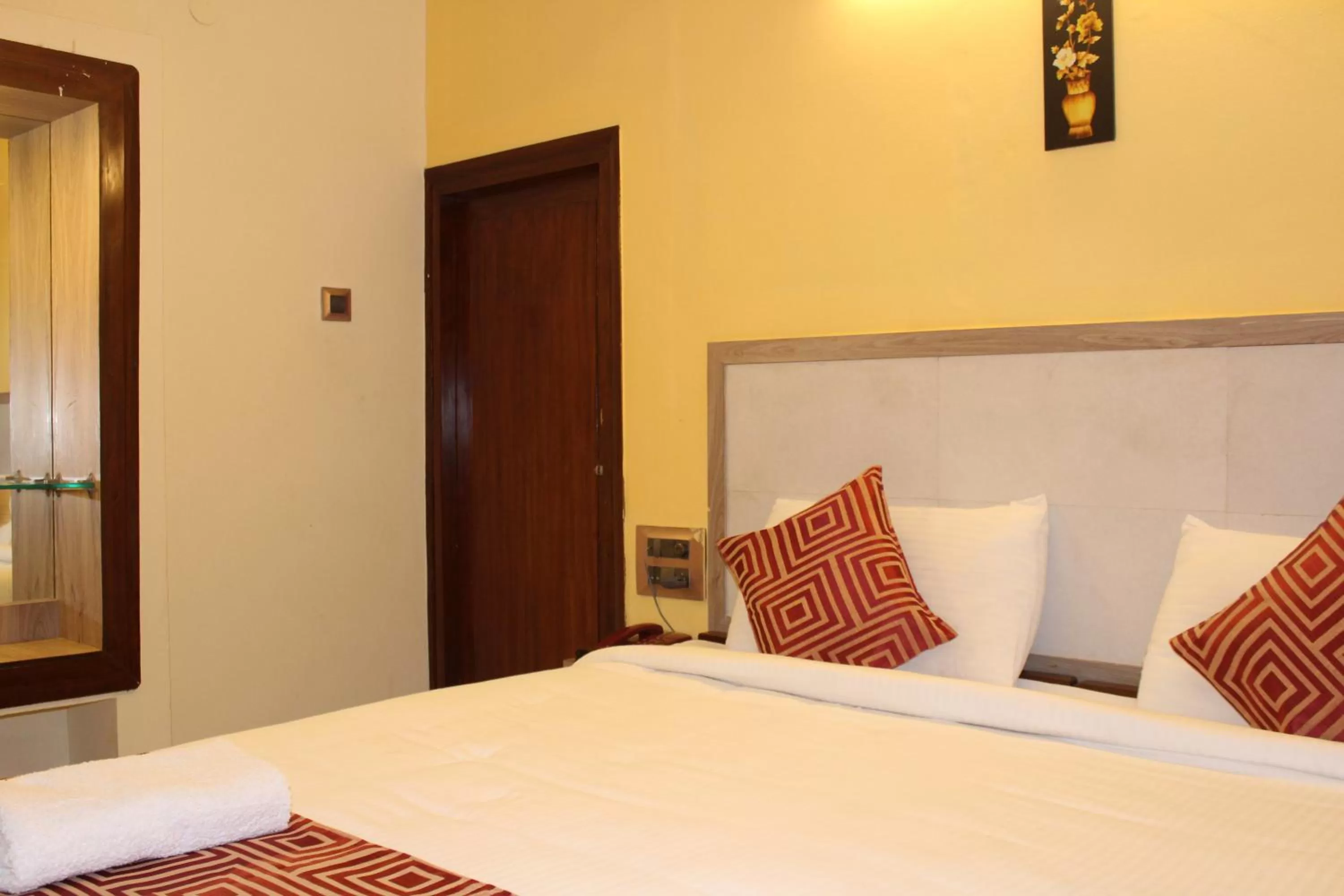 Bed in Hotel Kaveri