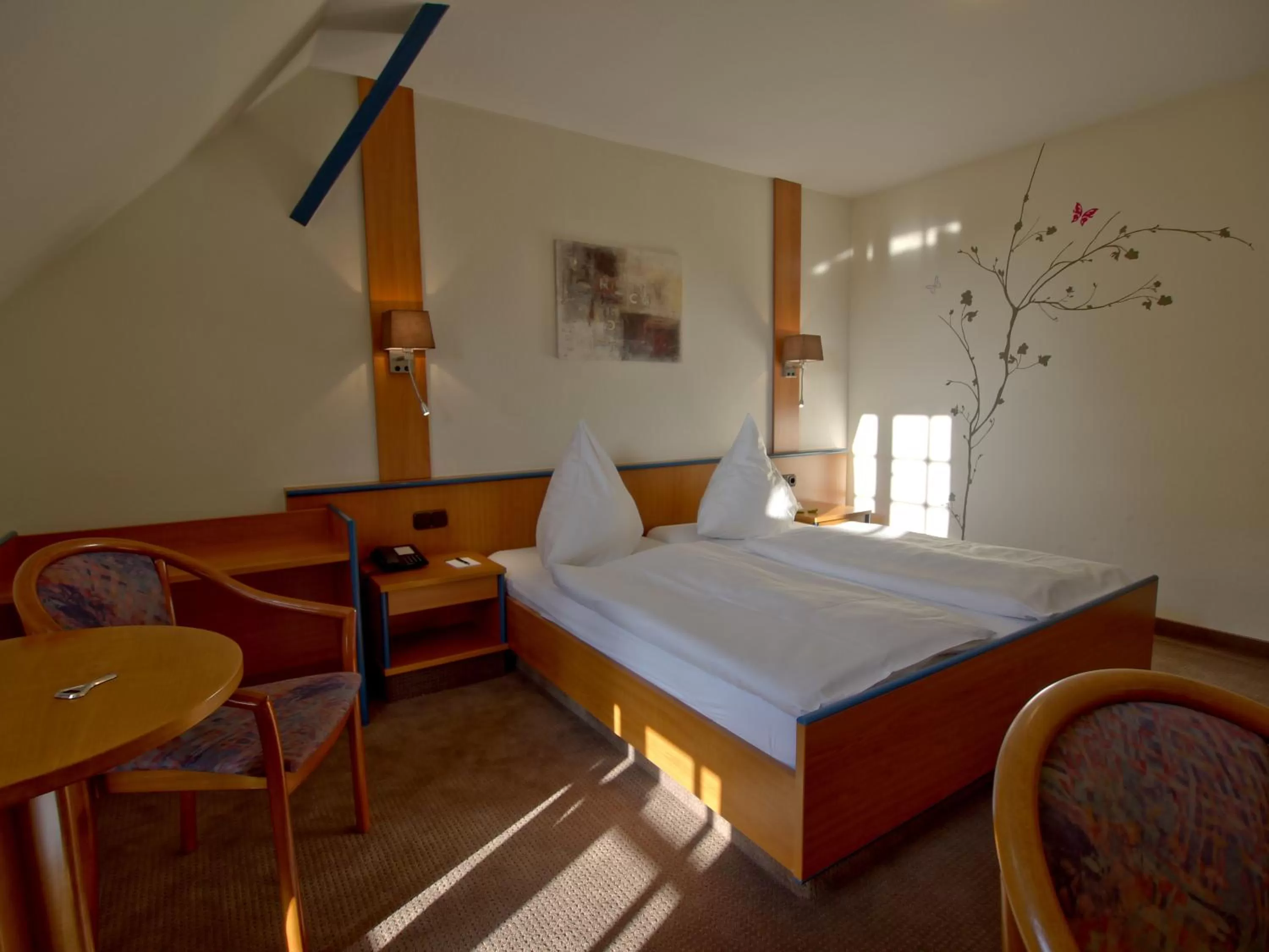 Bed in Hotel Friesische Wehde