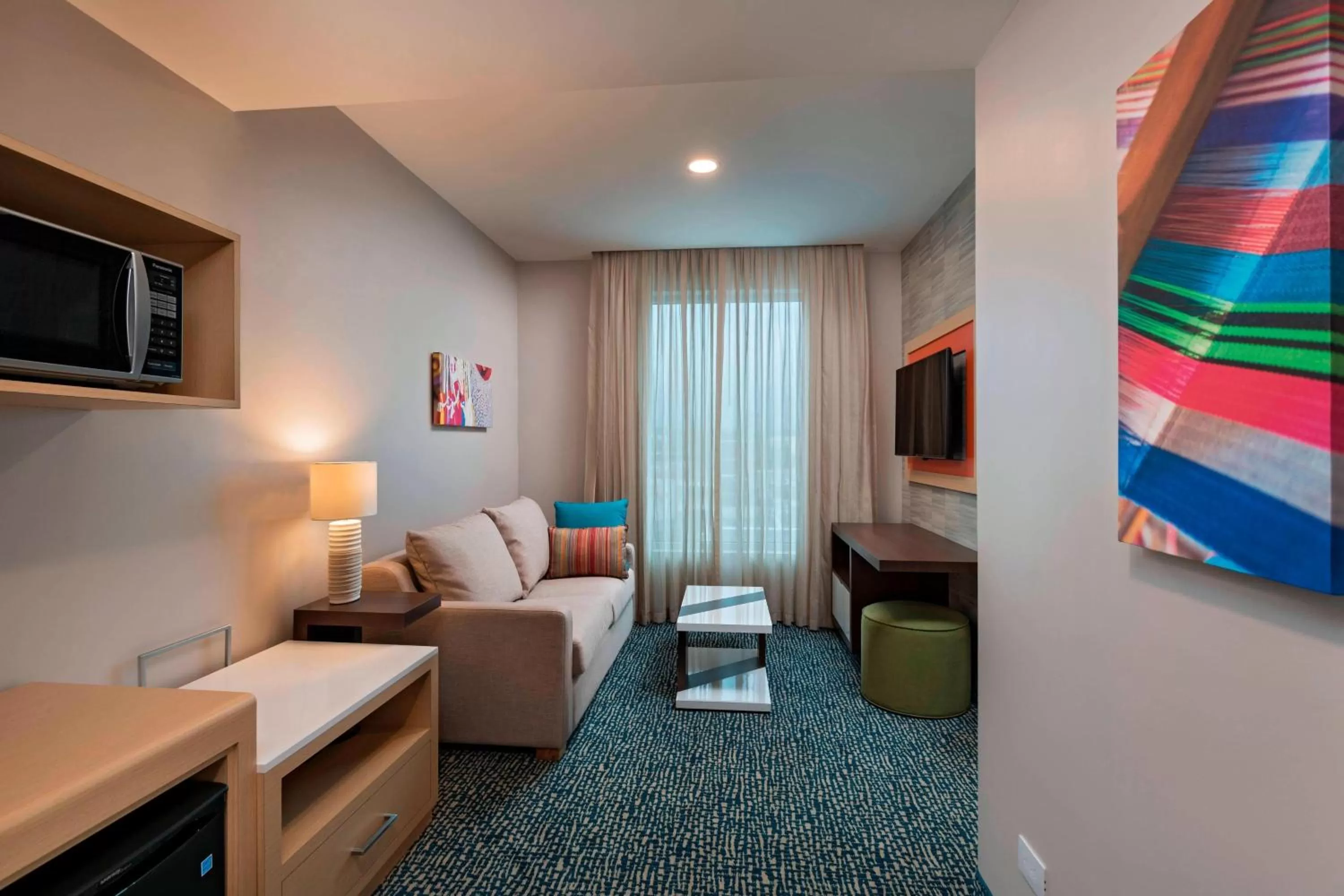 Living room in Fairfield by Marriott San Salvador