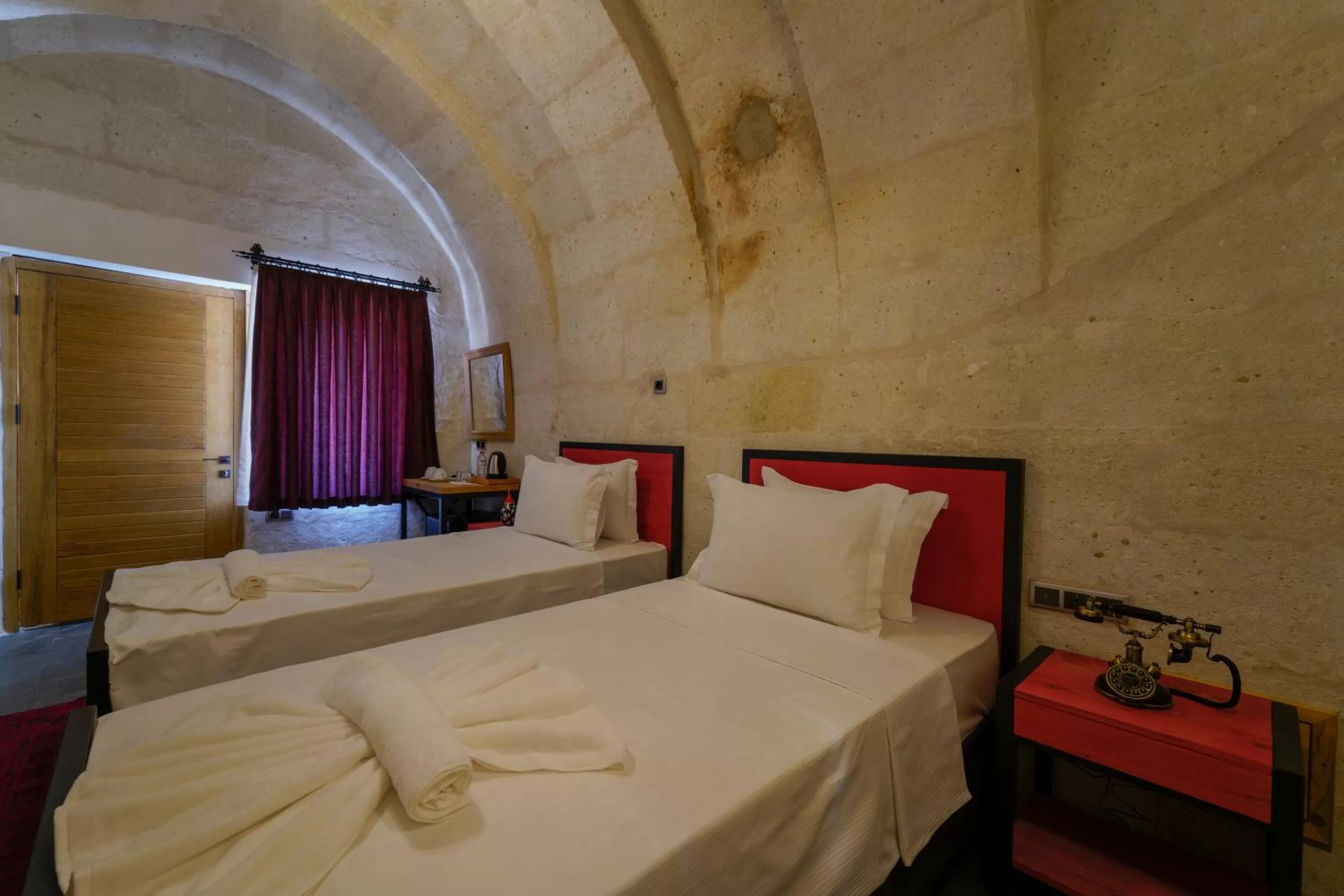 Bed in The Niche Cave Hotel