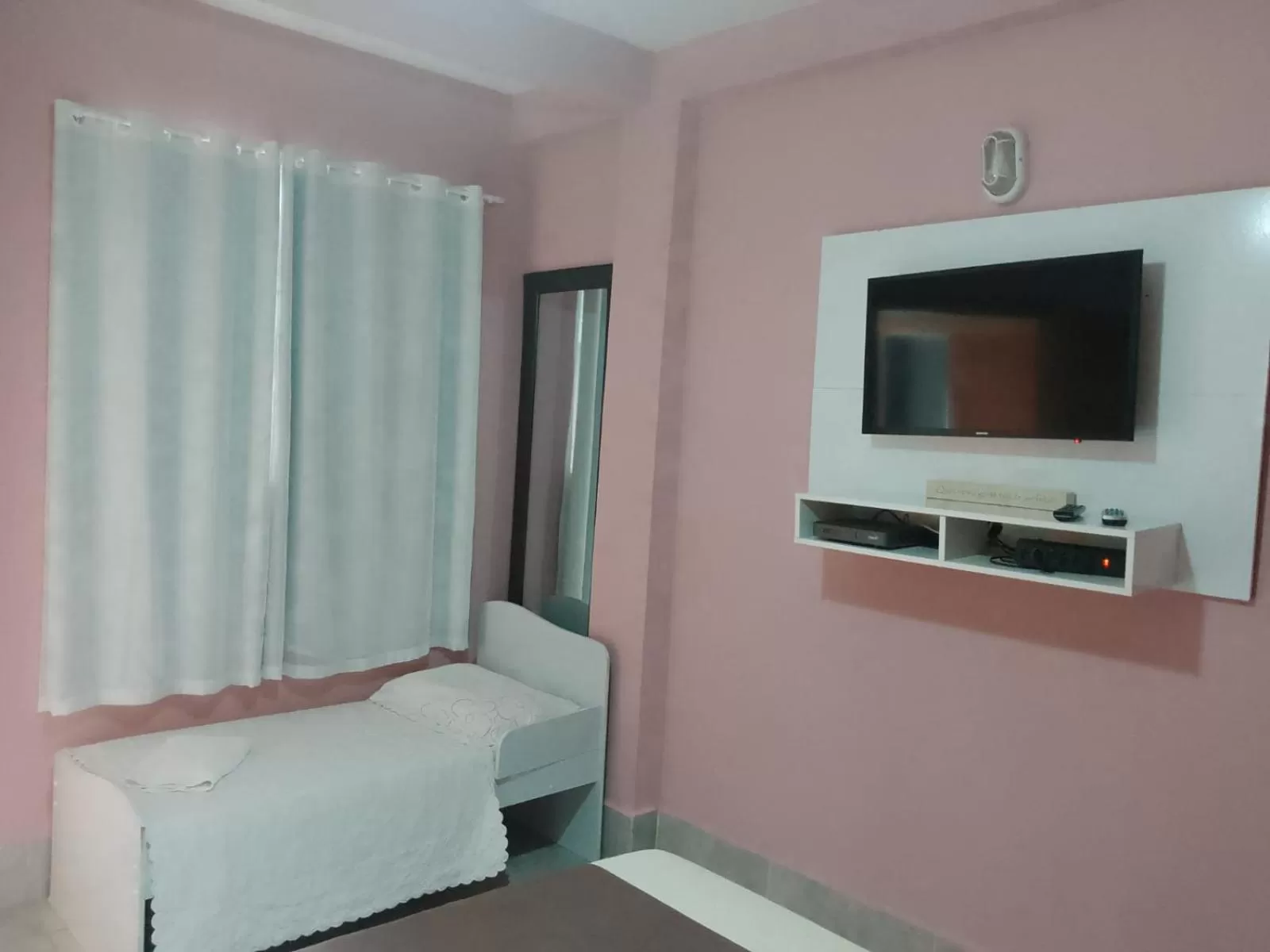 Bed in Pousada da Gi Suítes e Turismo