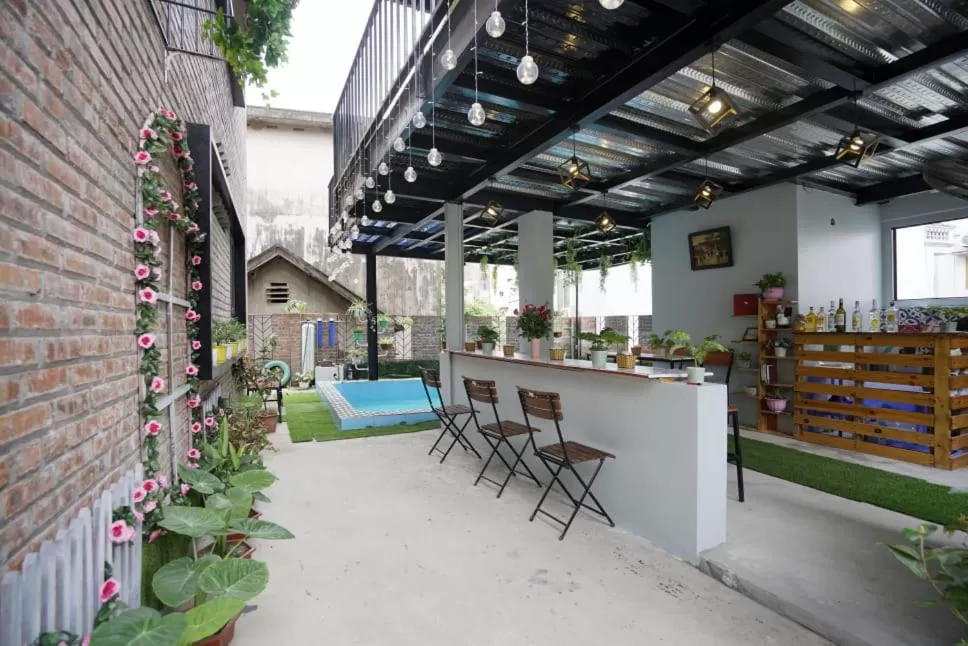 Patio, Restaurant/Places to Eat in Almor Hostel With Pool in right center