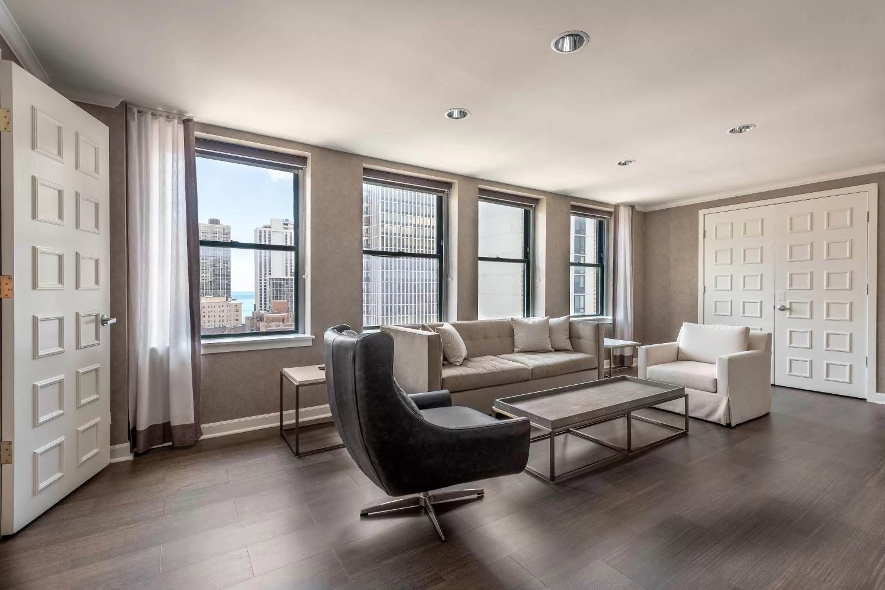 Living room in Claridge House Chicago, Tapestry Collection by Hilton