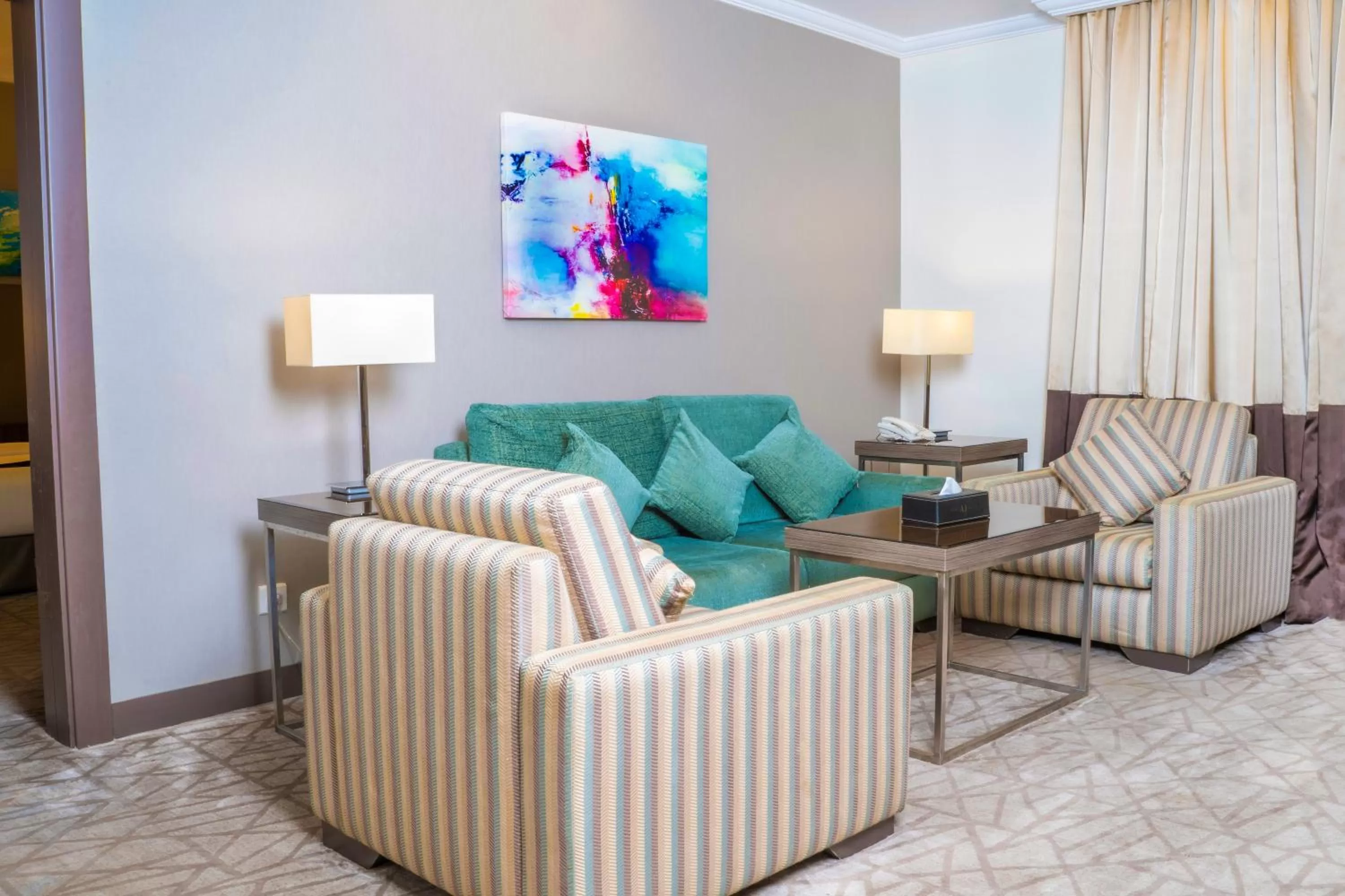 Seating area in Aquila Al Hamra Hotel