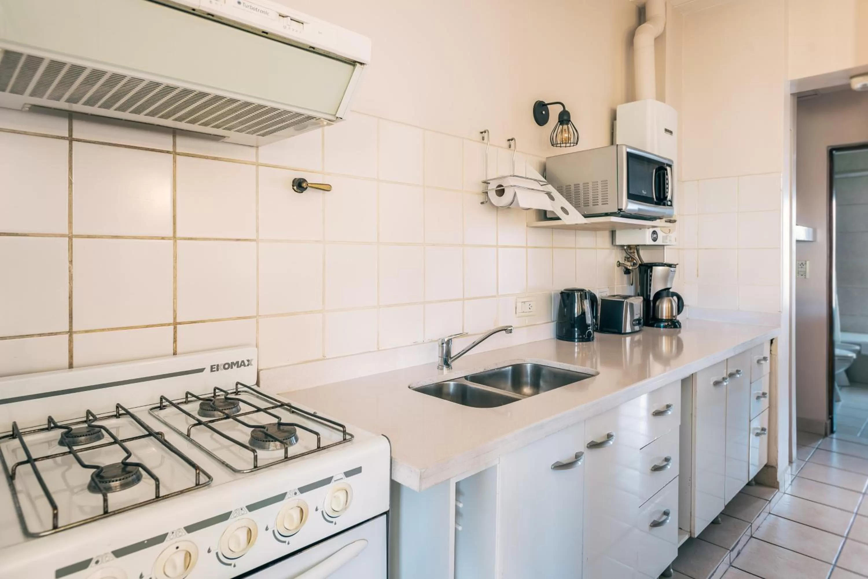 Coffee/tea facilities, Kitchen/Kitchenette in Riviera Fueguina Apartments