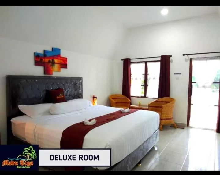 Bed in Madu Tiga Beach and Resort