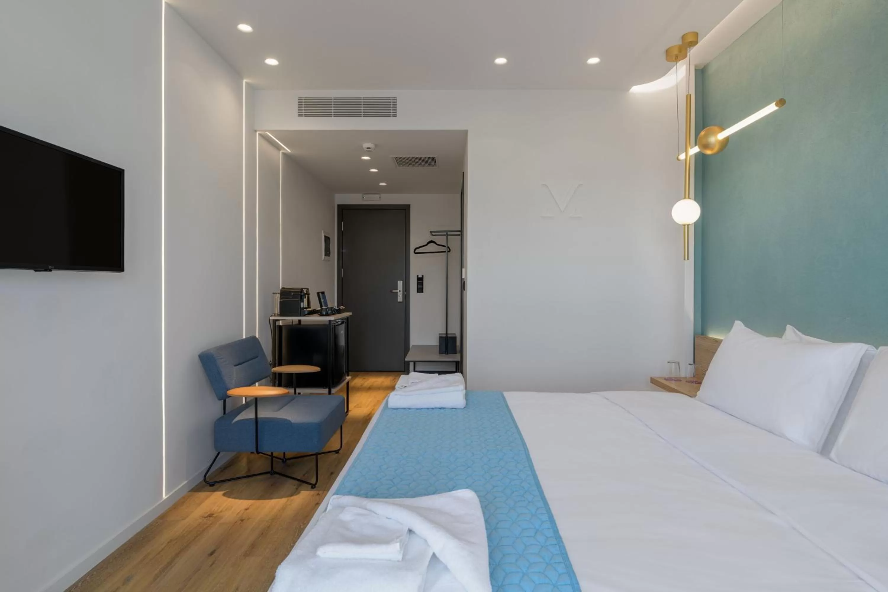 Bed in Acropolis Magenta Luxury Suites