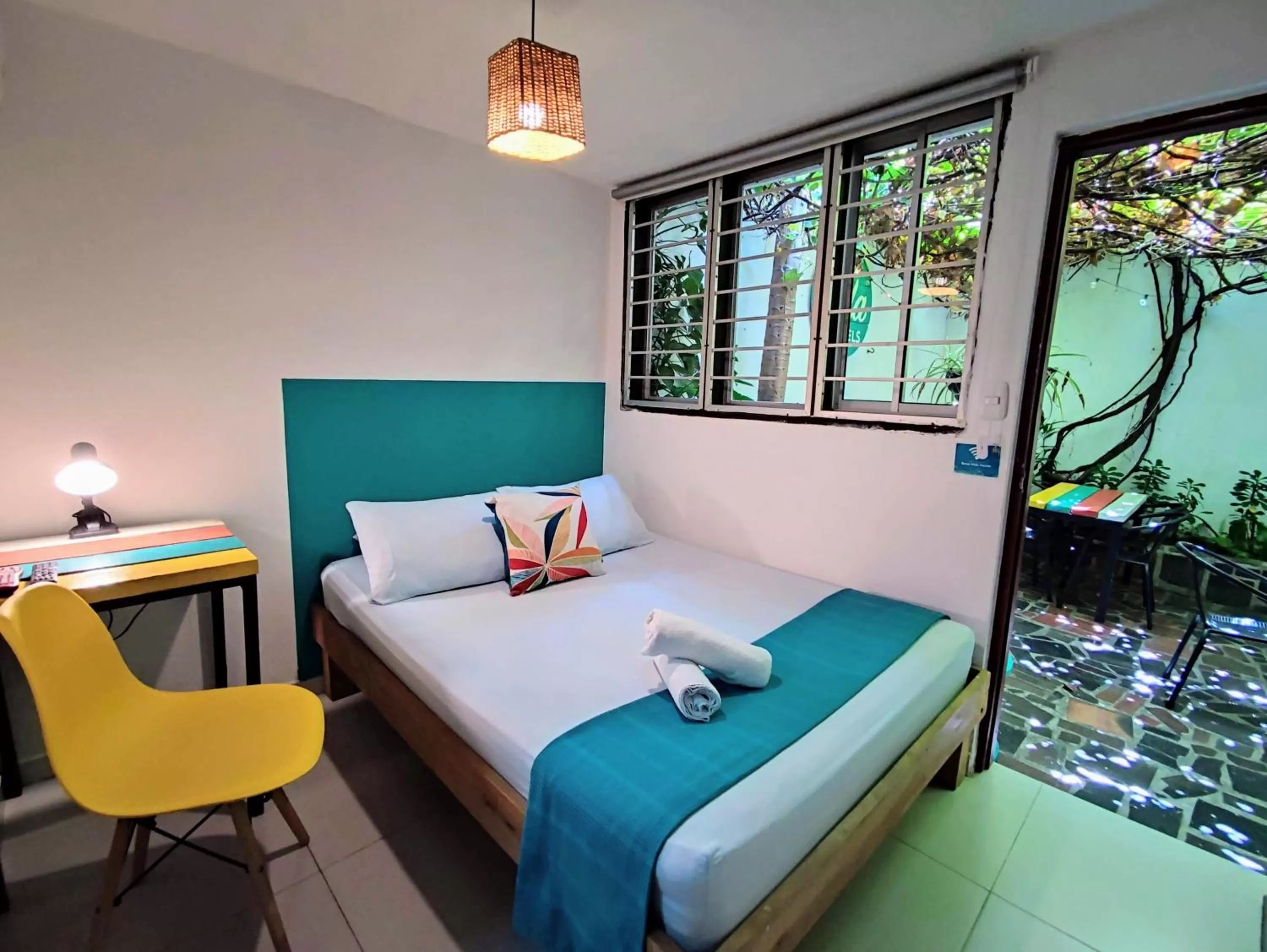 Bed in Bona Vida Hotel