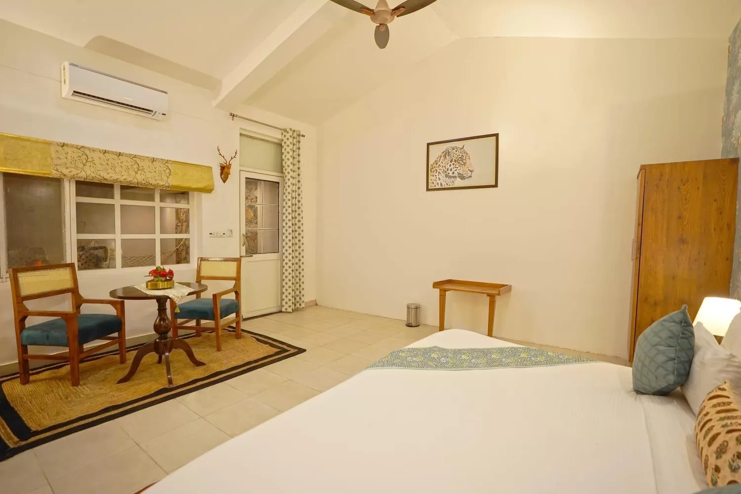 fireplace, Bed in Astroport Sariska Treetop by Eight Continents