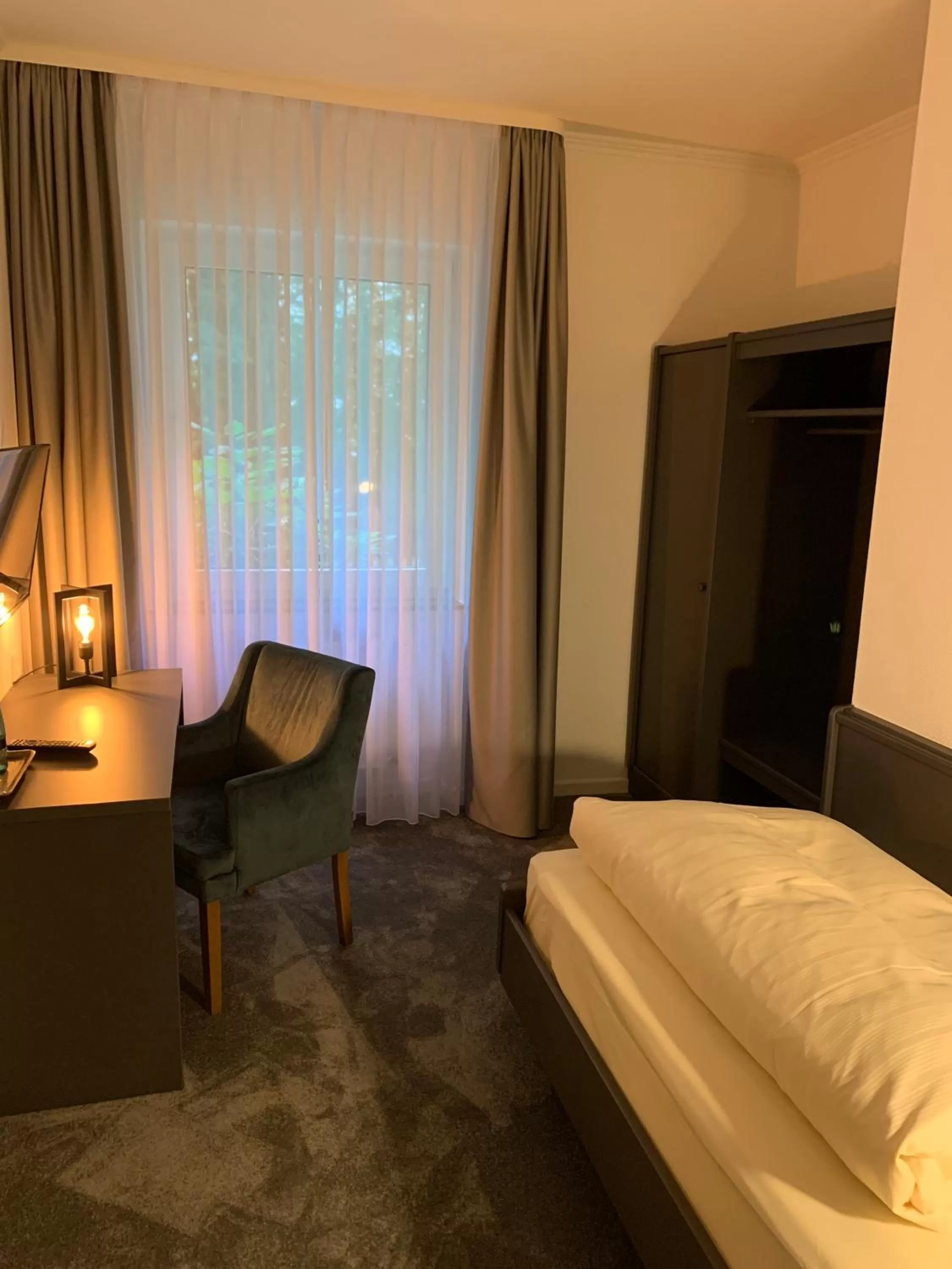 Photo of the whole room, Bed in Waldhotel Riesebusch