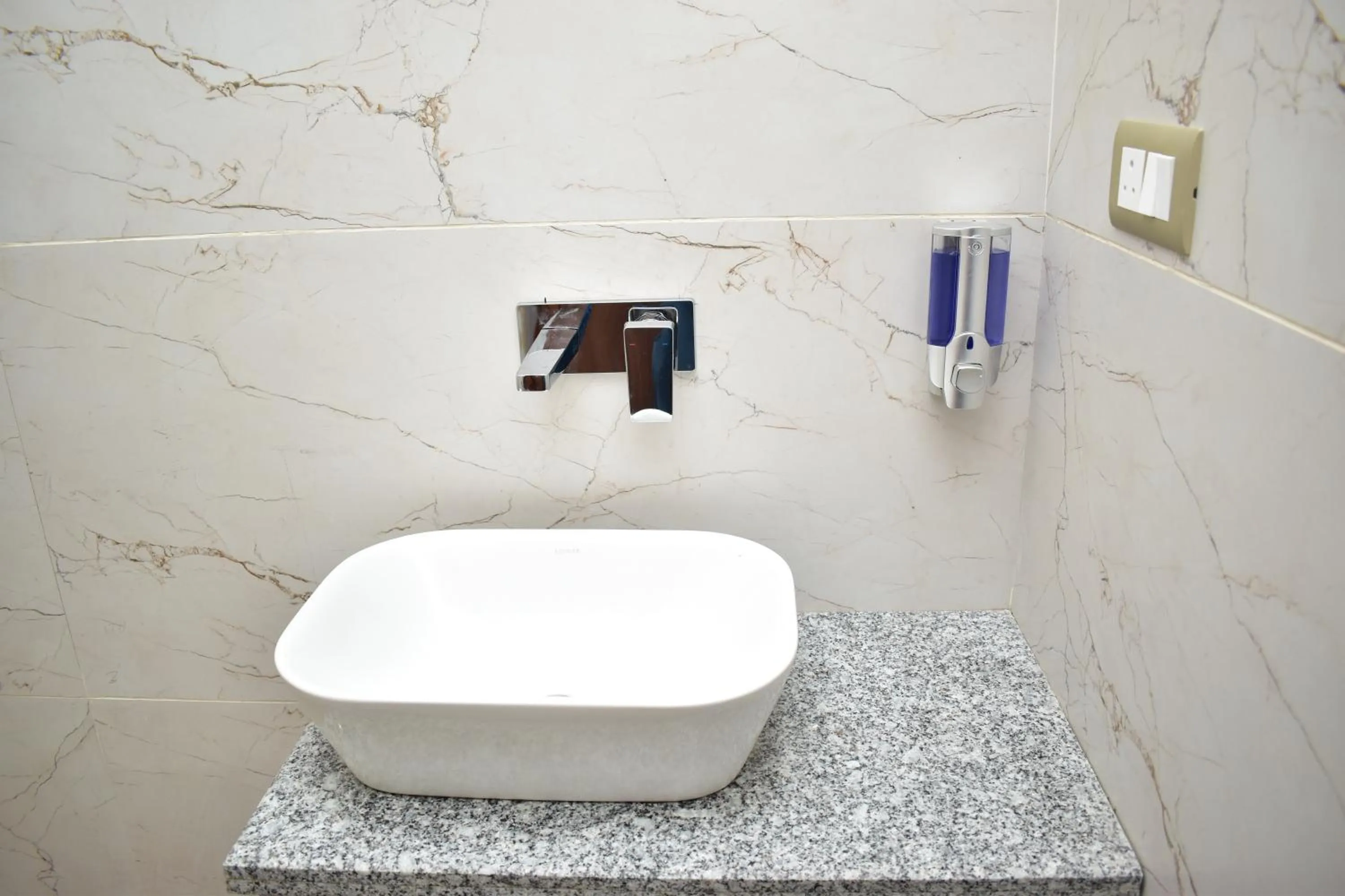 Bathroom in Qotel Comfort Ashok Vihar - Near Delhi University