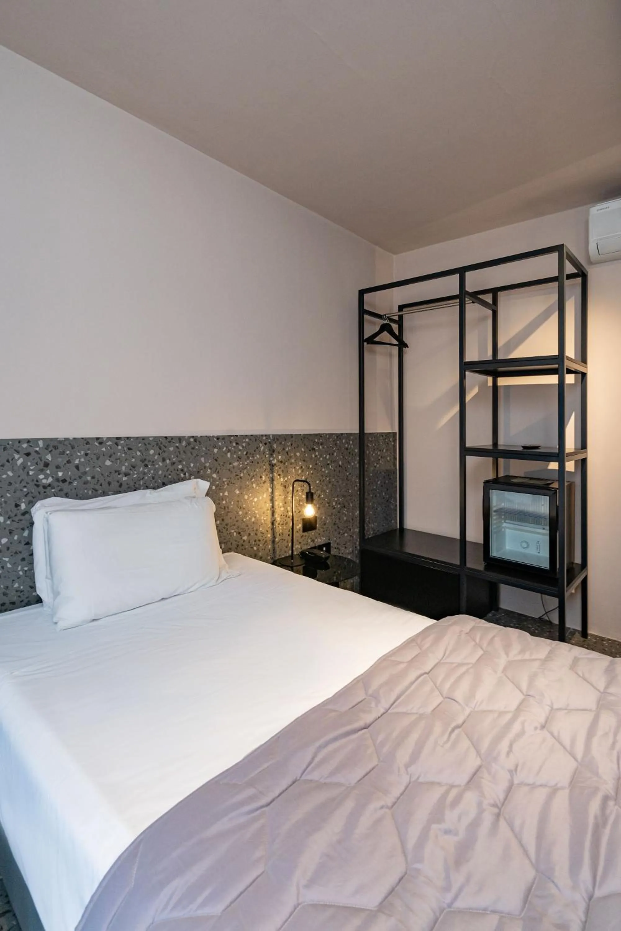 Bed in Elide Design Hotel