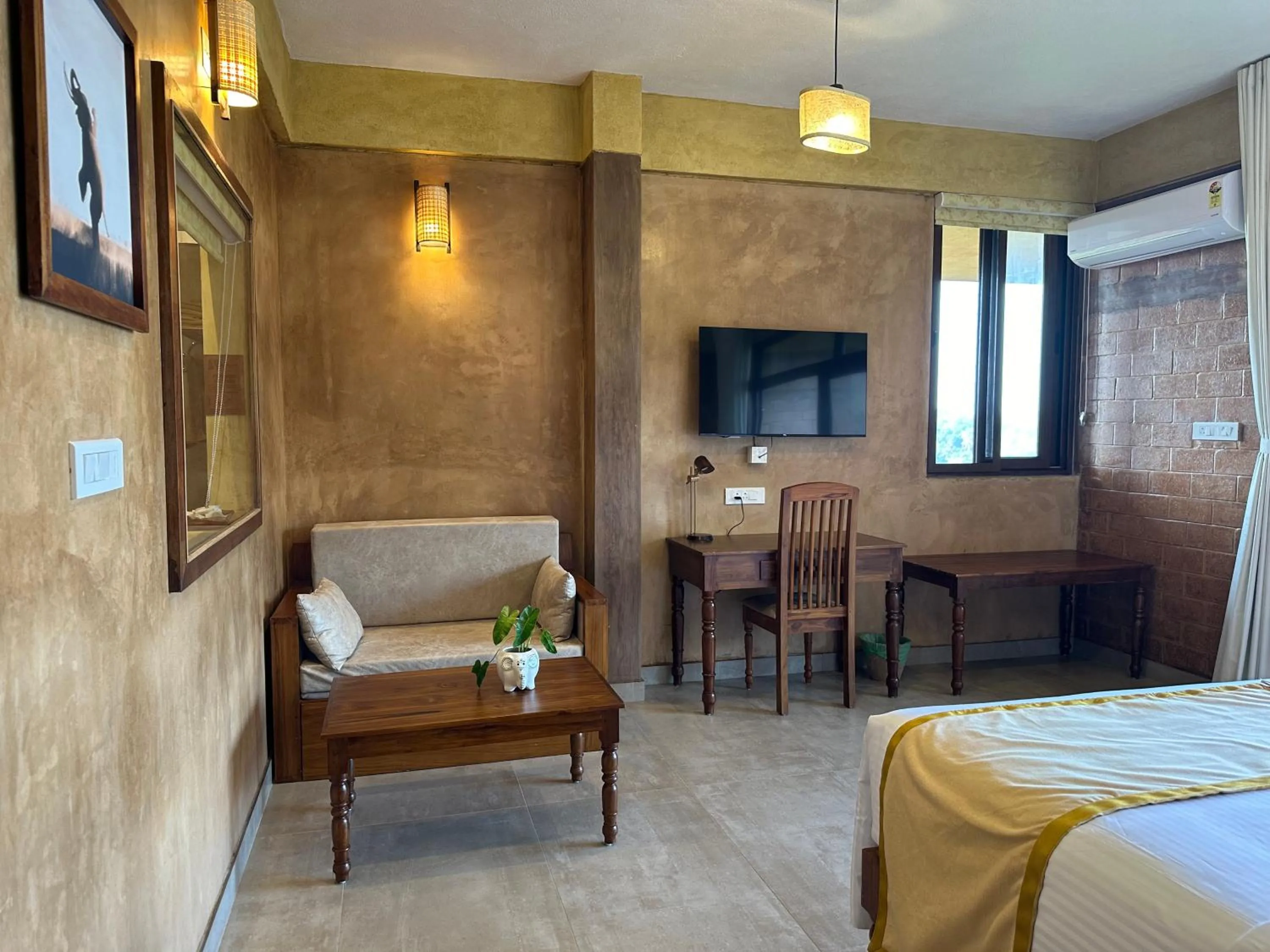 Seating area, Bed in AMARA AYURVEDA RETREAT- Overlooking Evergreen Western Ghats an ecologically sustainable living space in Kovalam