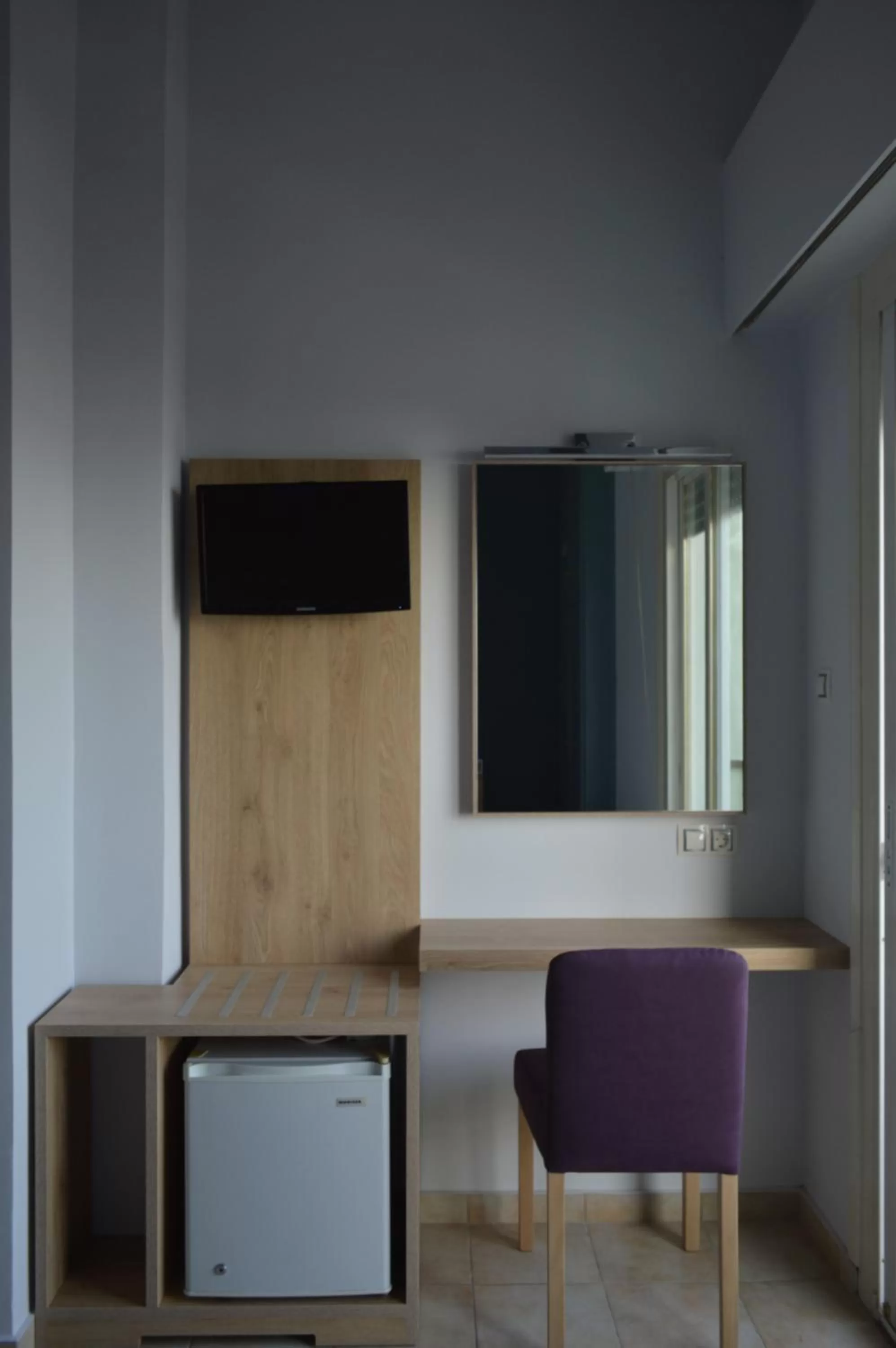 Photo of the whole room, TV/Entertainment Center in Hotel Plaza