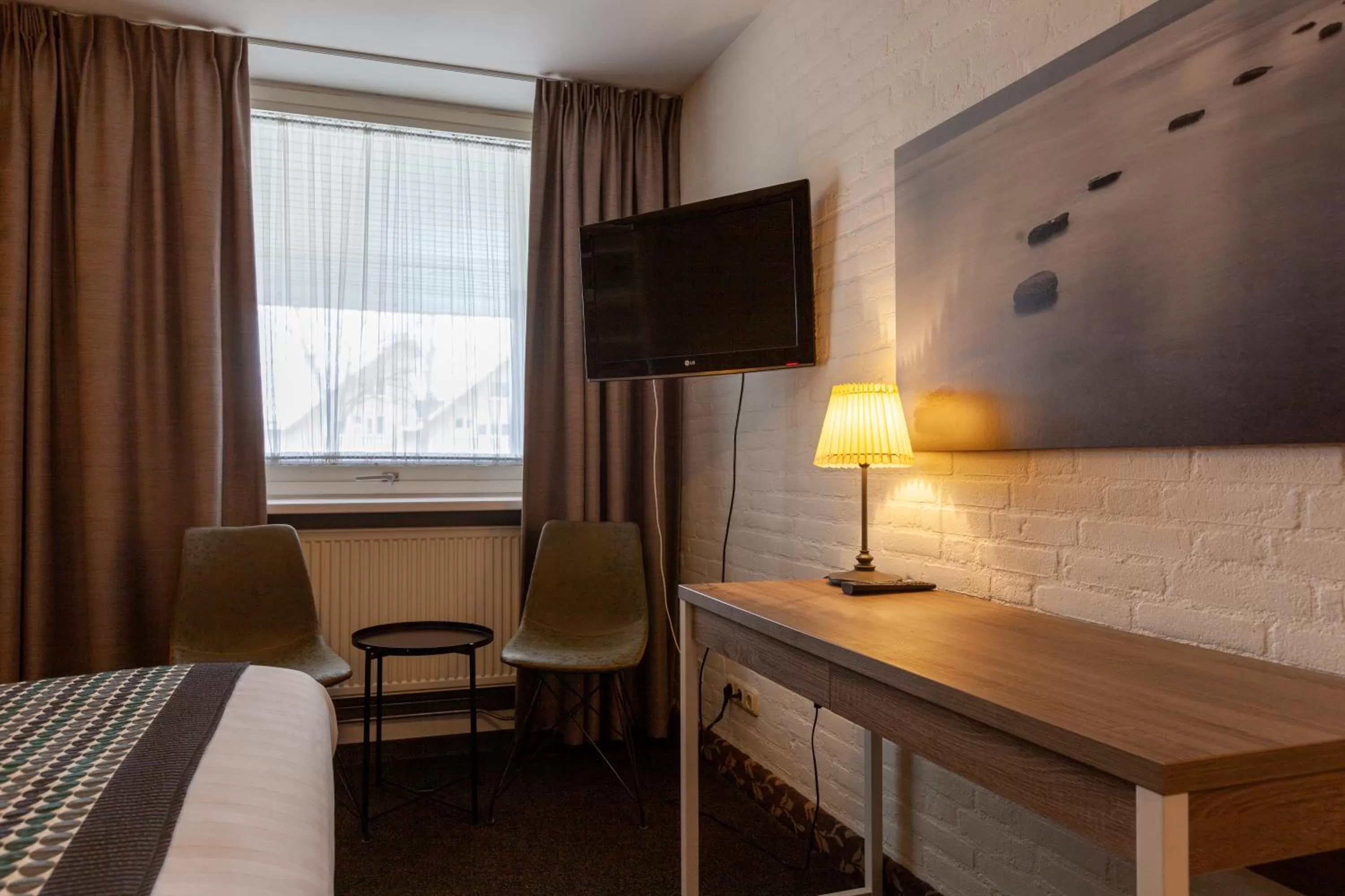 Seating area, Bed in Amsterdam Hotel Uithoorn