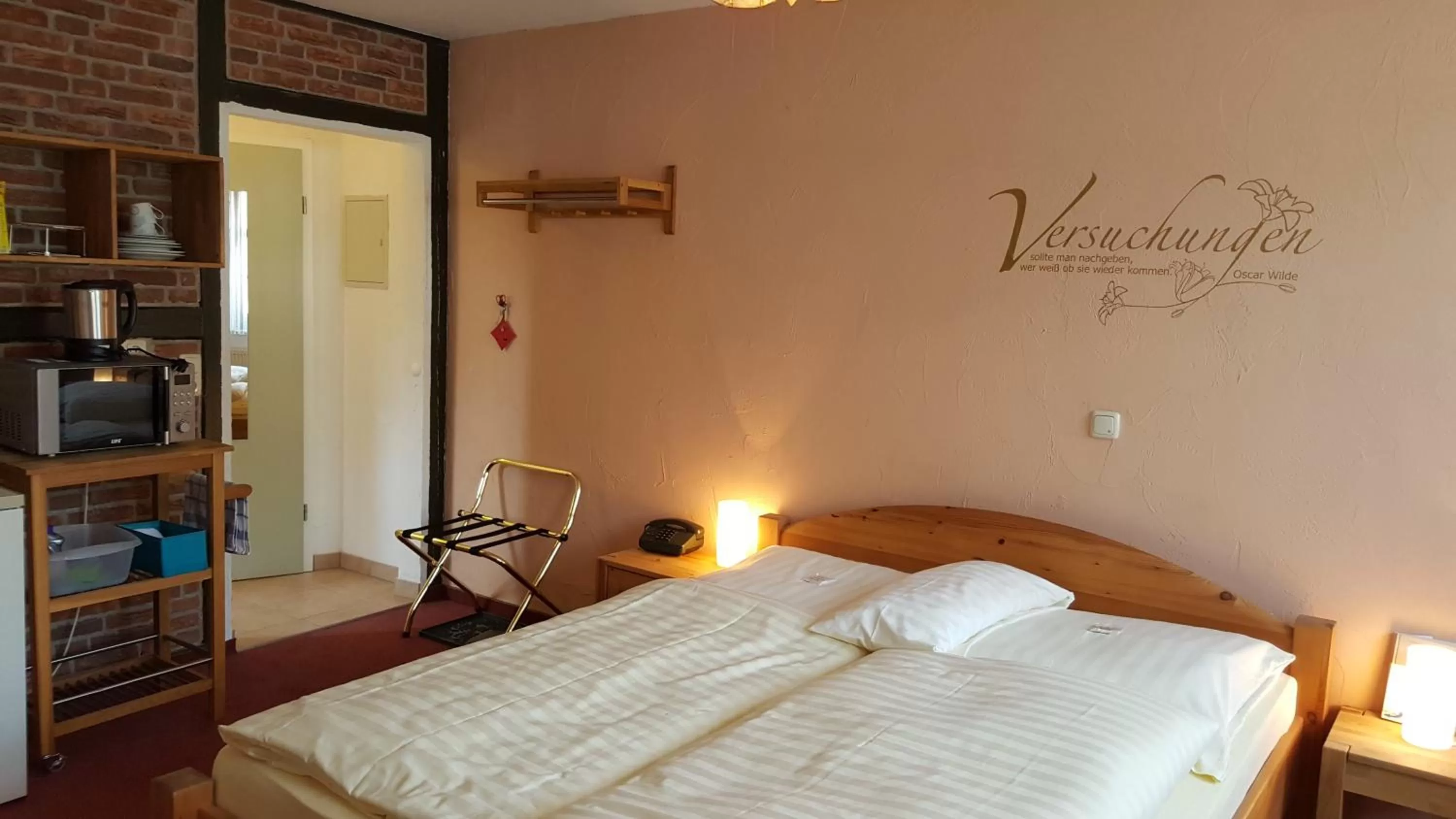 Photo of the whole room, Bed in Hotel Goldflair am Rathaus