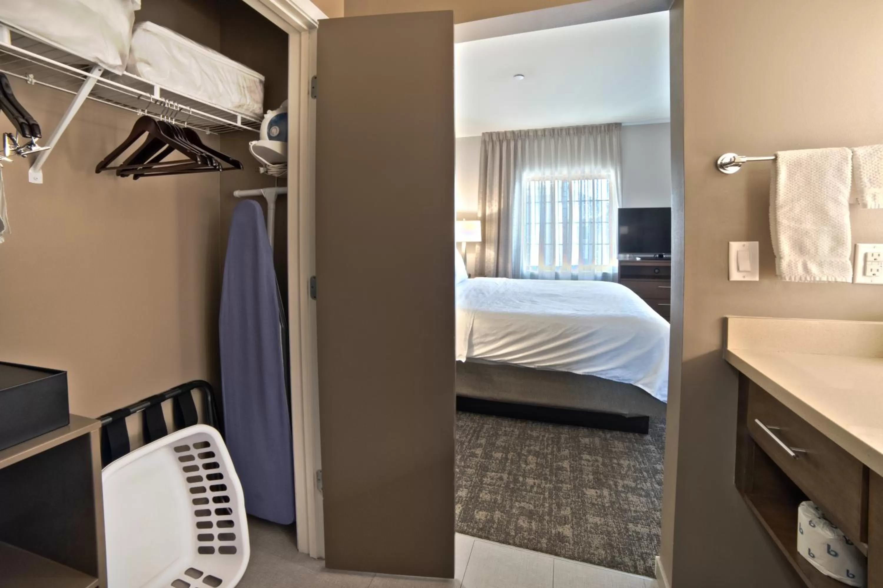 wardrobe, Bed in Staybridge Suites Houston - Humble Beltway 8 E by IHG