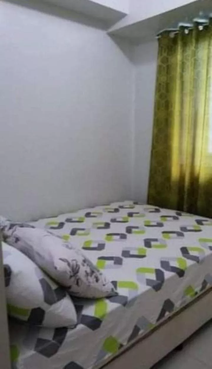 Bed in Sea Residences Homey Condo by DNJ