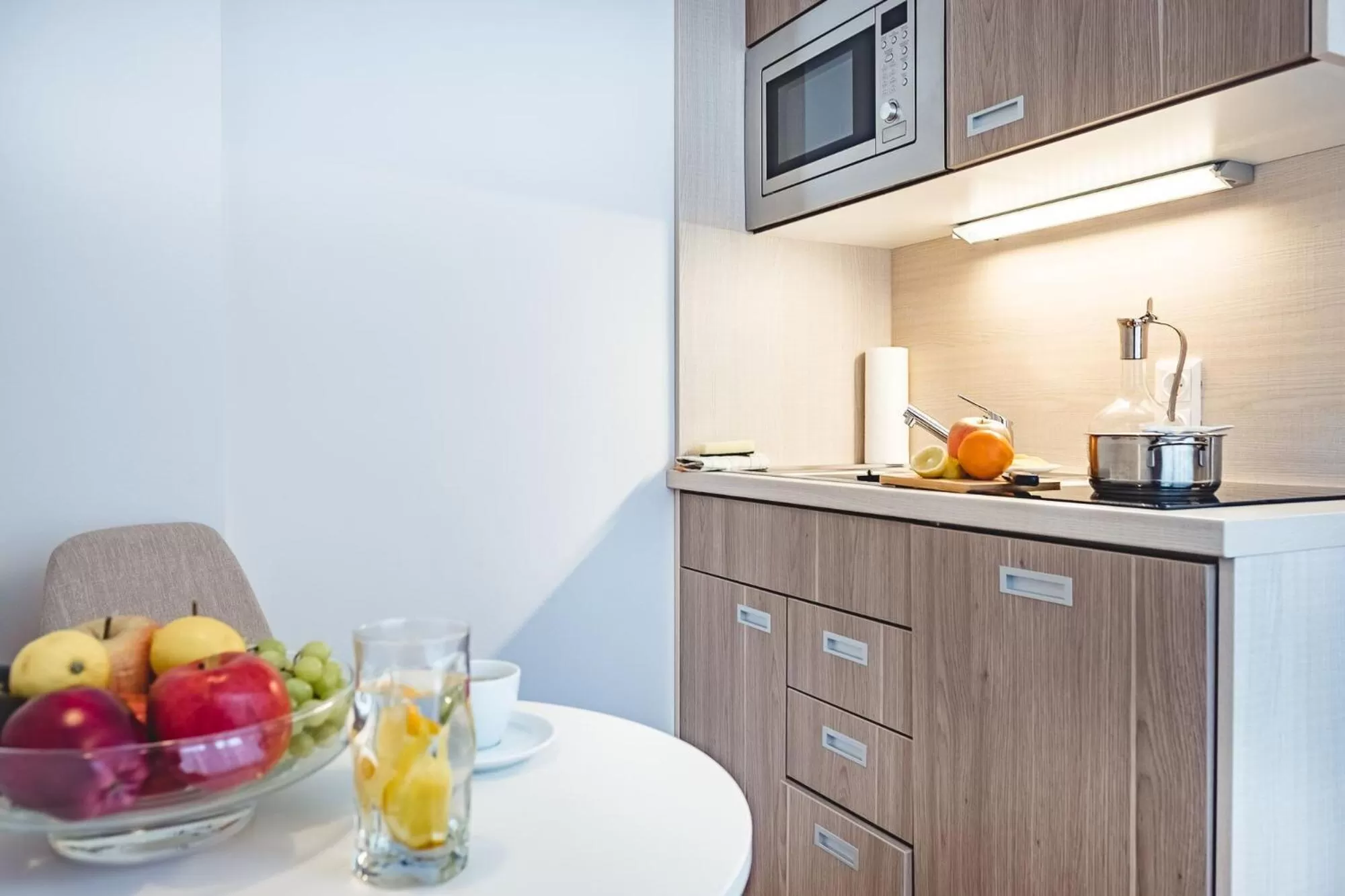 Kitchen or kitchenette in Oliver Apartments | contactless check-in