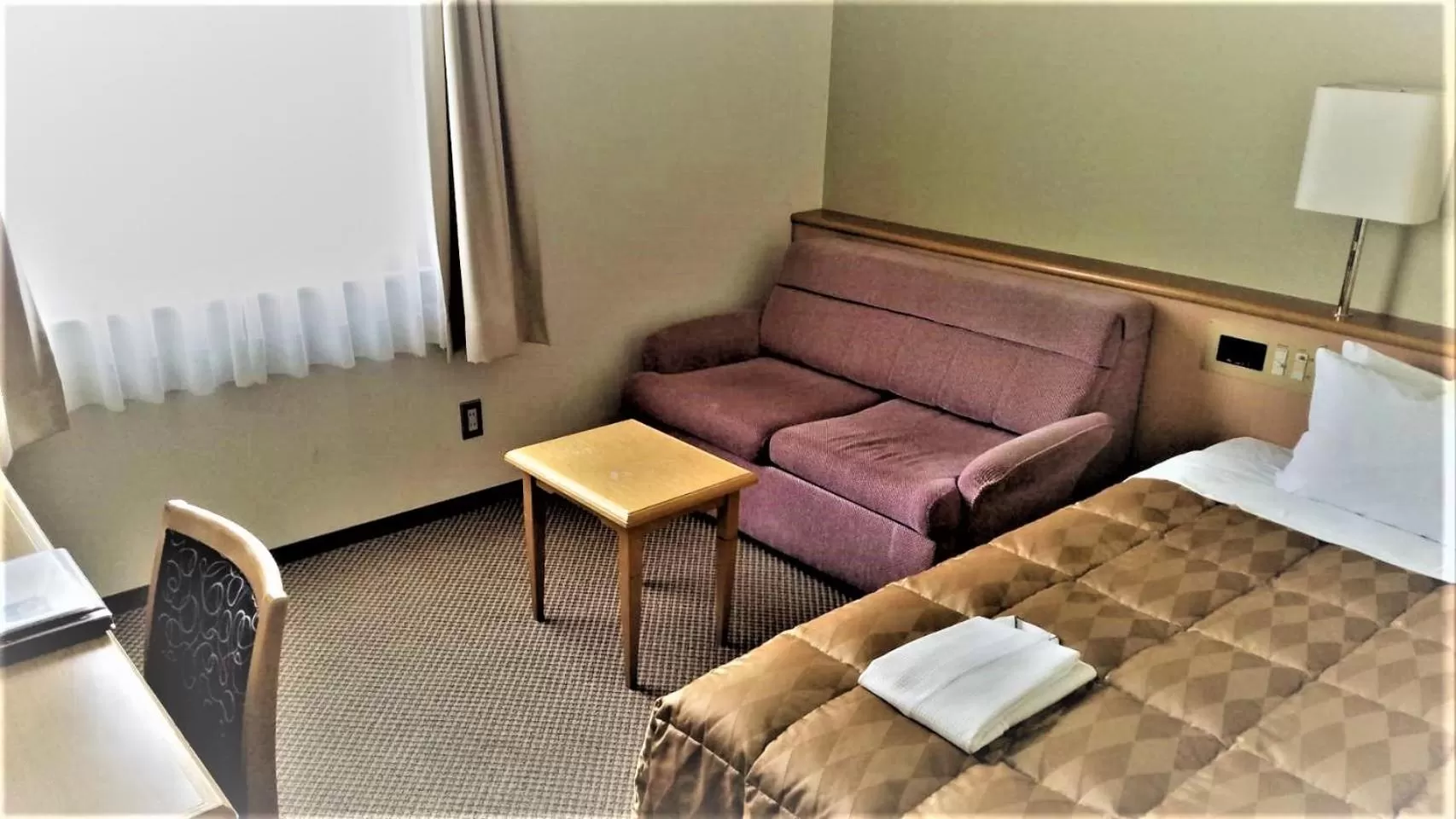 Bed in Ishinomaki Grand Hotel