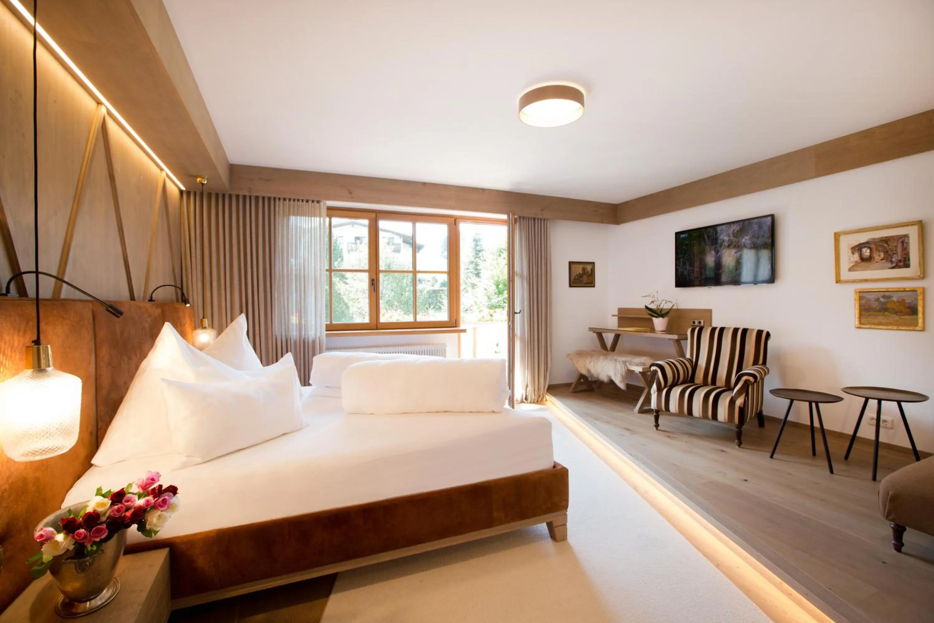 Photo of the whole room, Bed in Geniesserhotel Minglers Sportalm 4 Sterne Superior