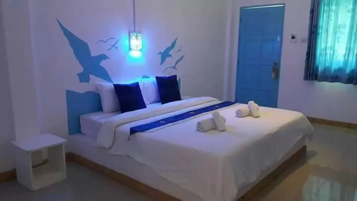 Bed in Bamboo House Resort