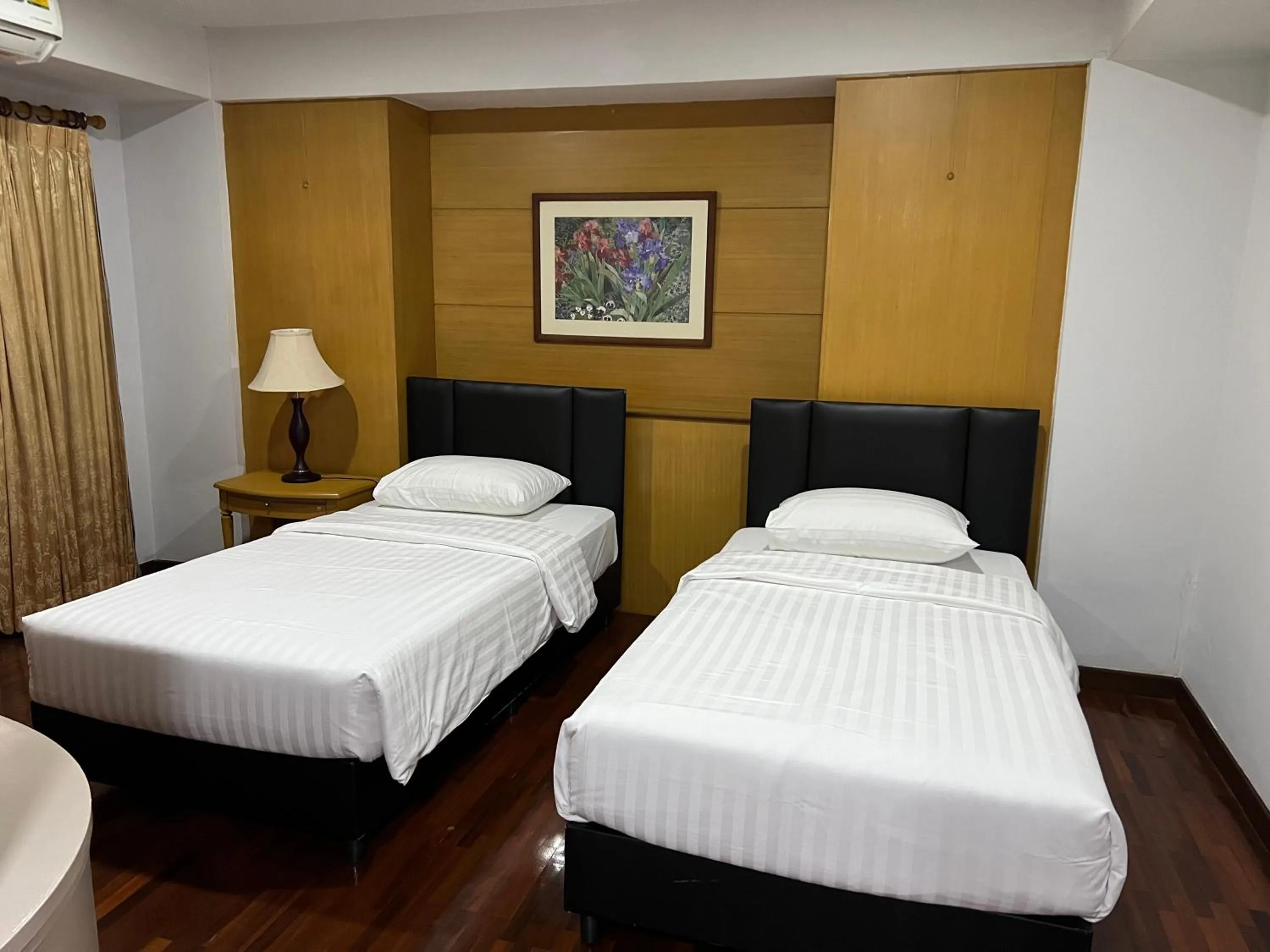 Bed in Mall Suites Hotel