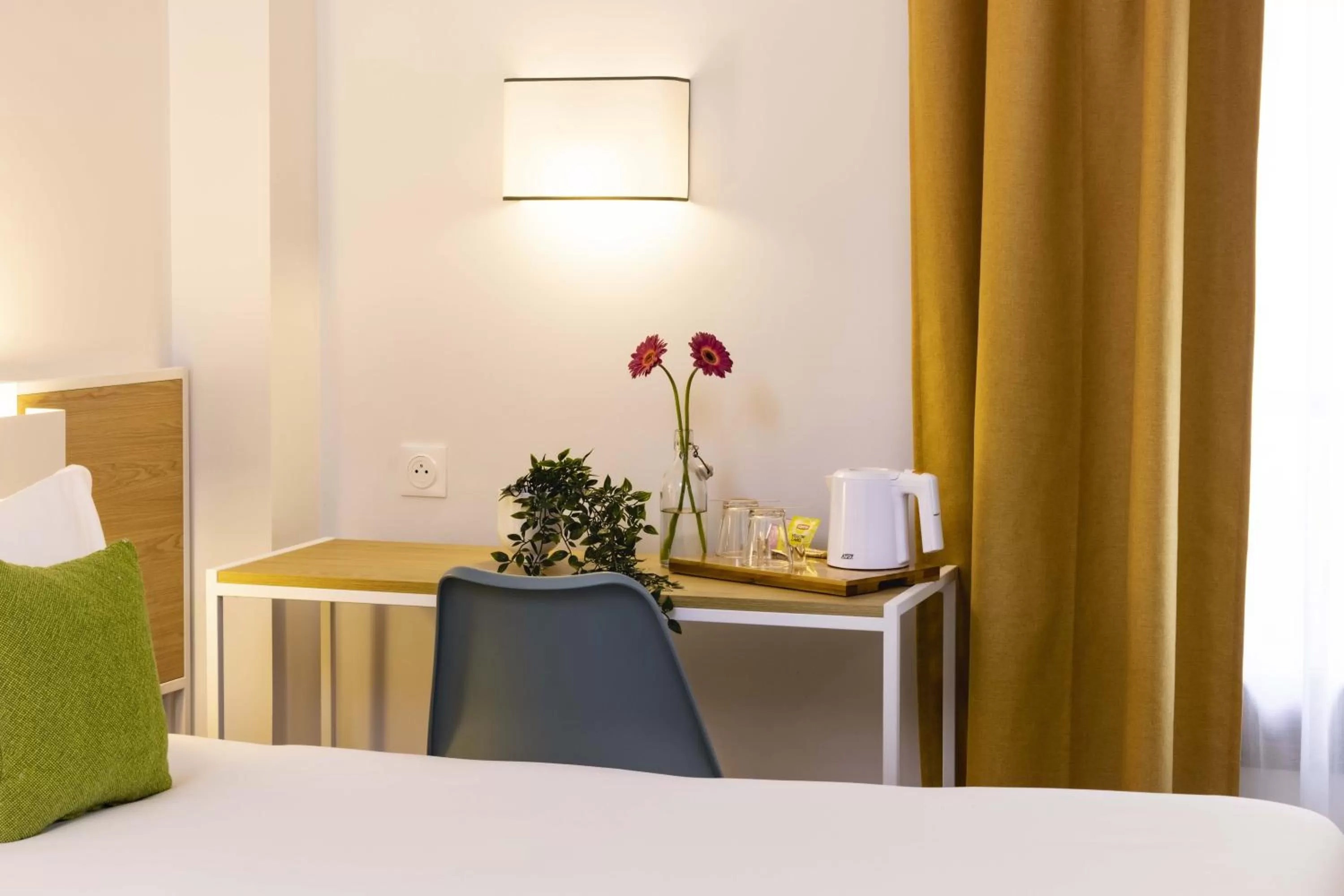 Bed in Hotel Paris Louis Blanc