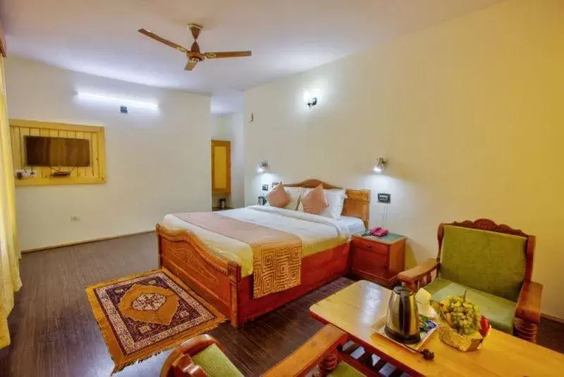 Deluxe Room in Ayushman Hotels Deluxe Room in Ayushman Hotels