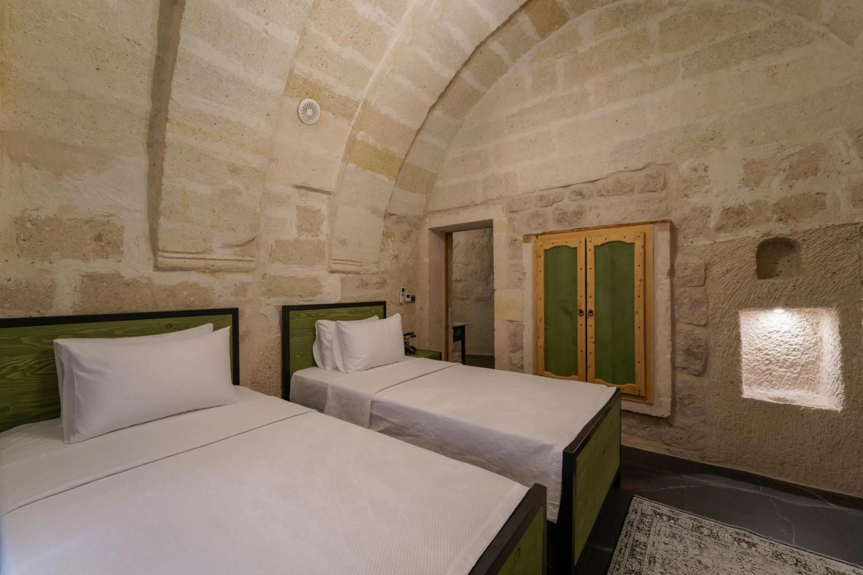 Bed in The Niche Cave Hotel