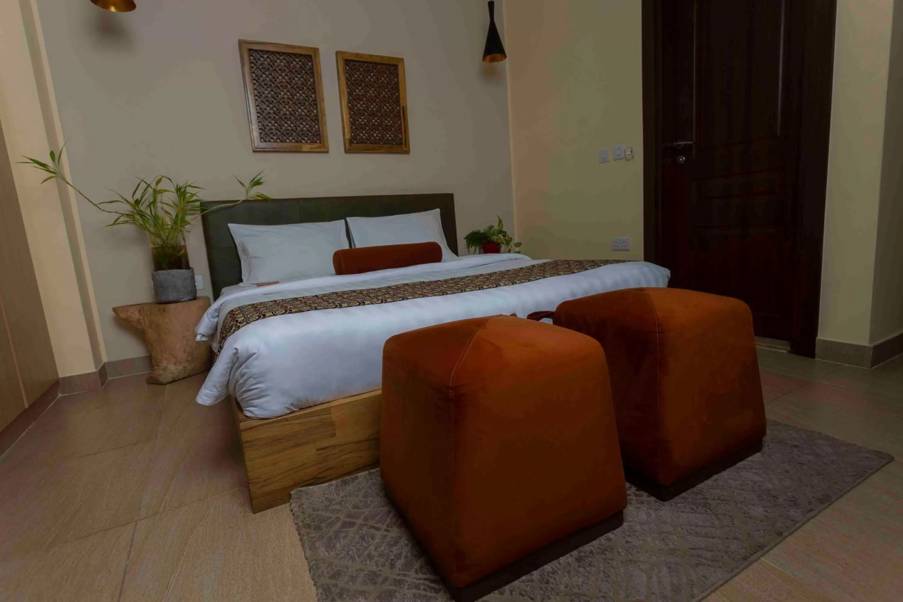 Bed in Roots Hotel Apartment