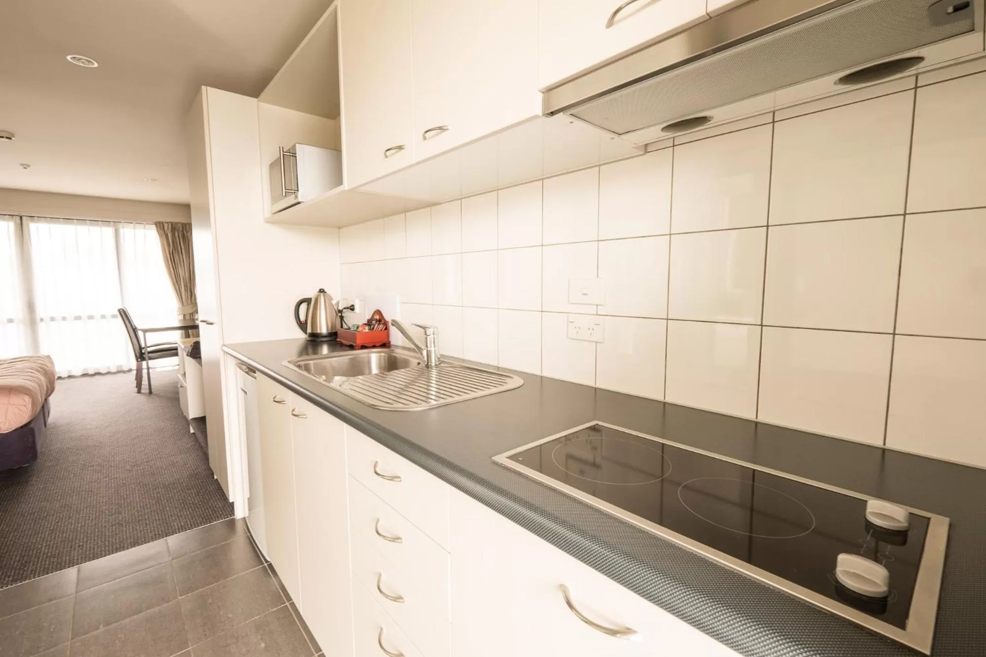 Kitchen or kitchenette in Azena Suites & Apartment