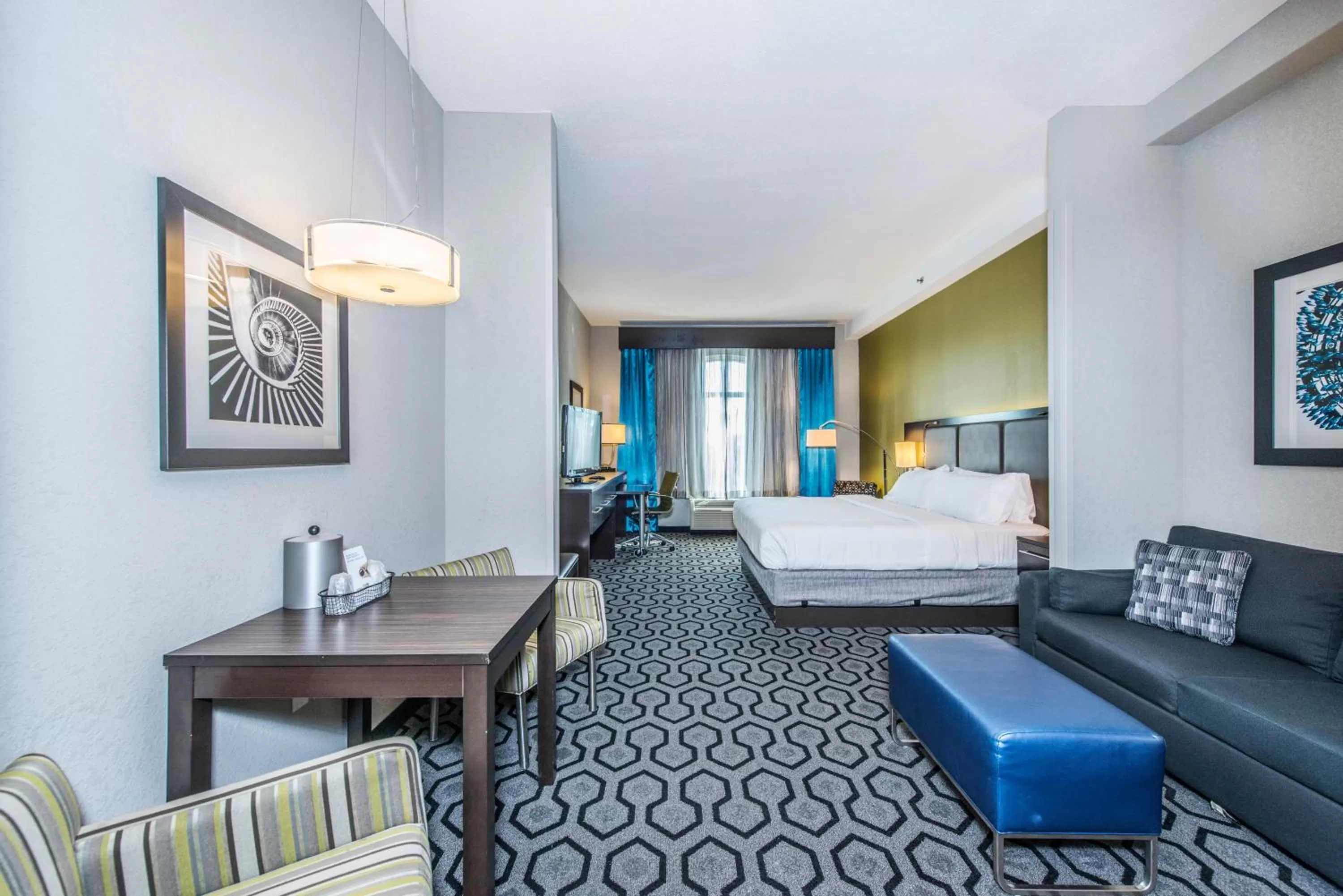 Living room, Bed in Holiday Inn Express & Suites Charleston Arpt-Conv Ctr Area by IHG