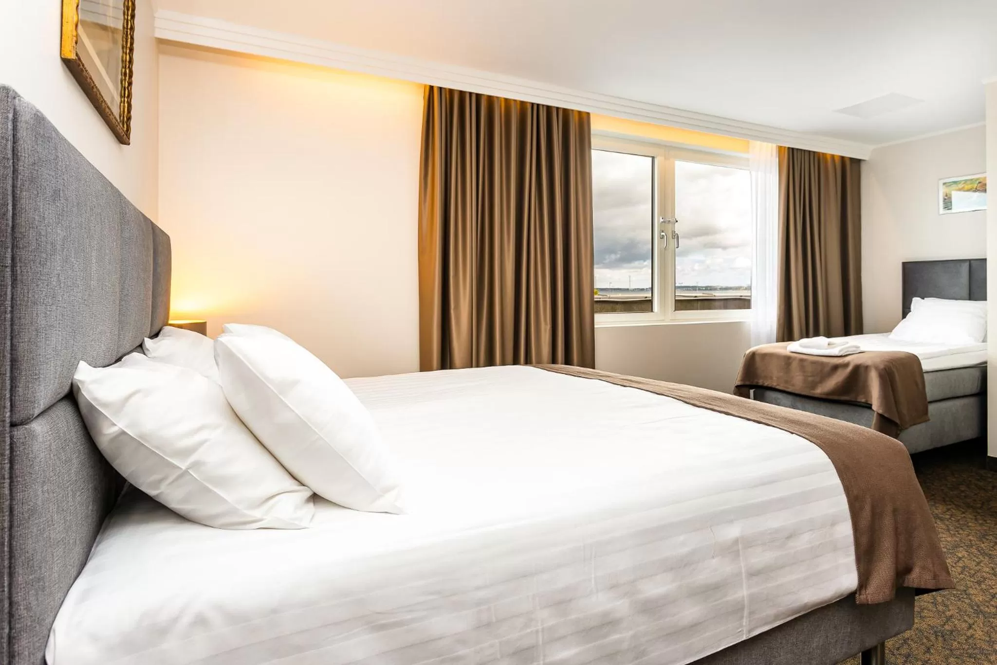 Bed in Adoryal Hotell