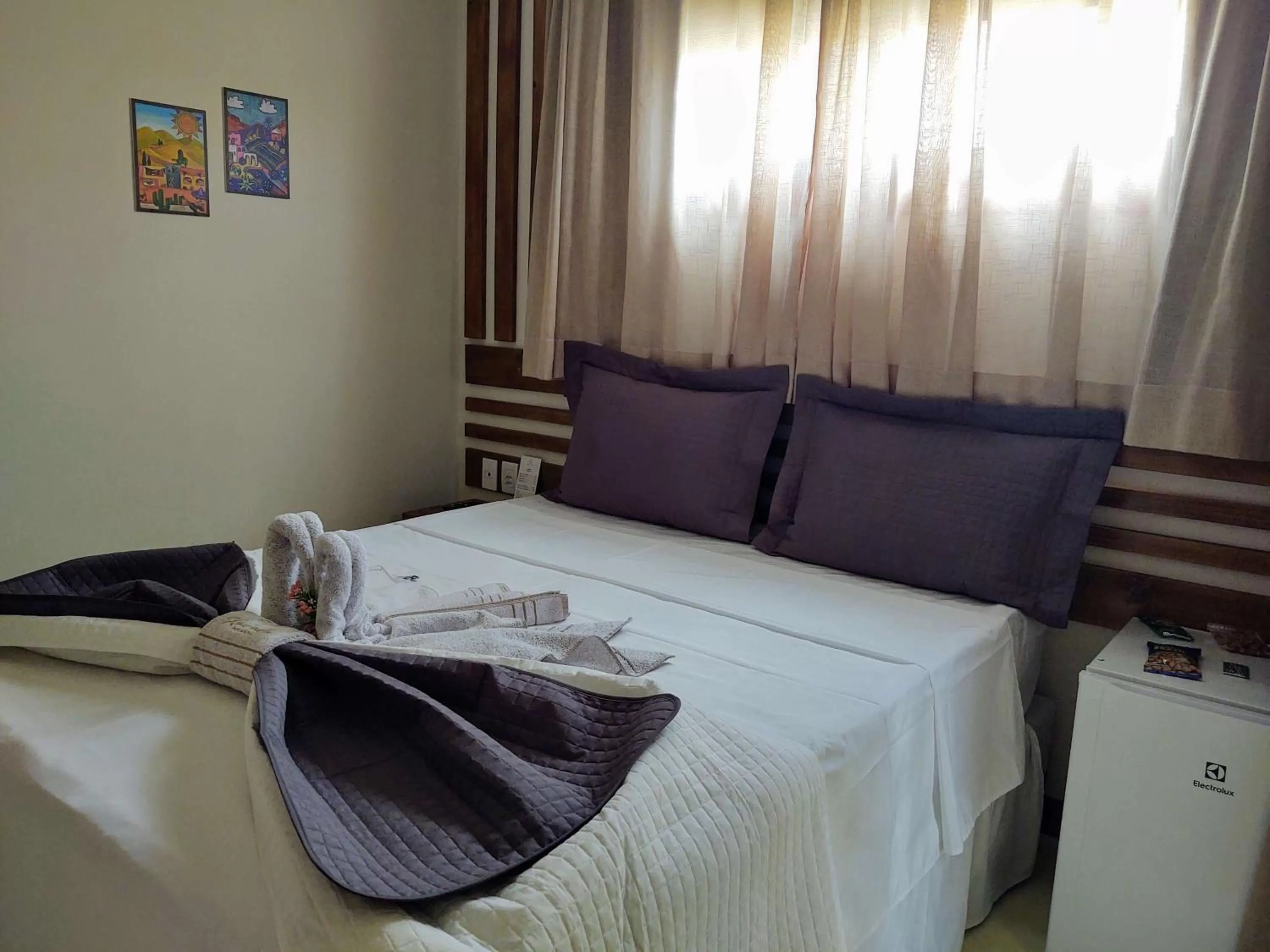 Bed in Kai'ala Pousada