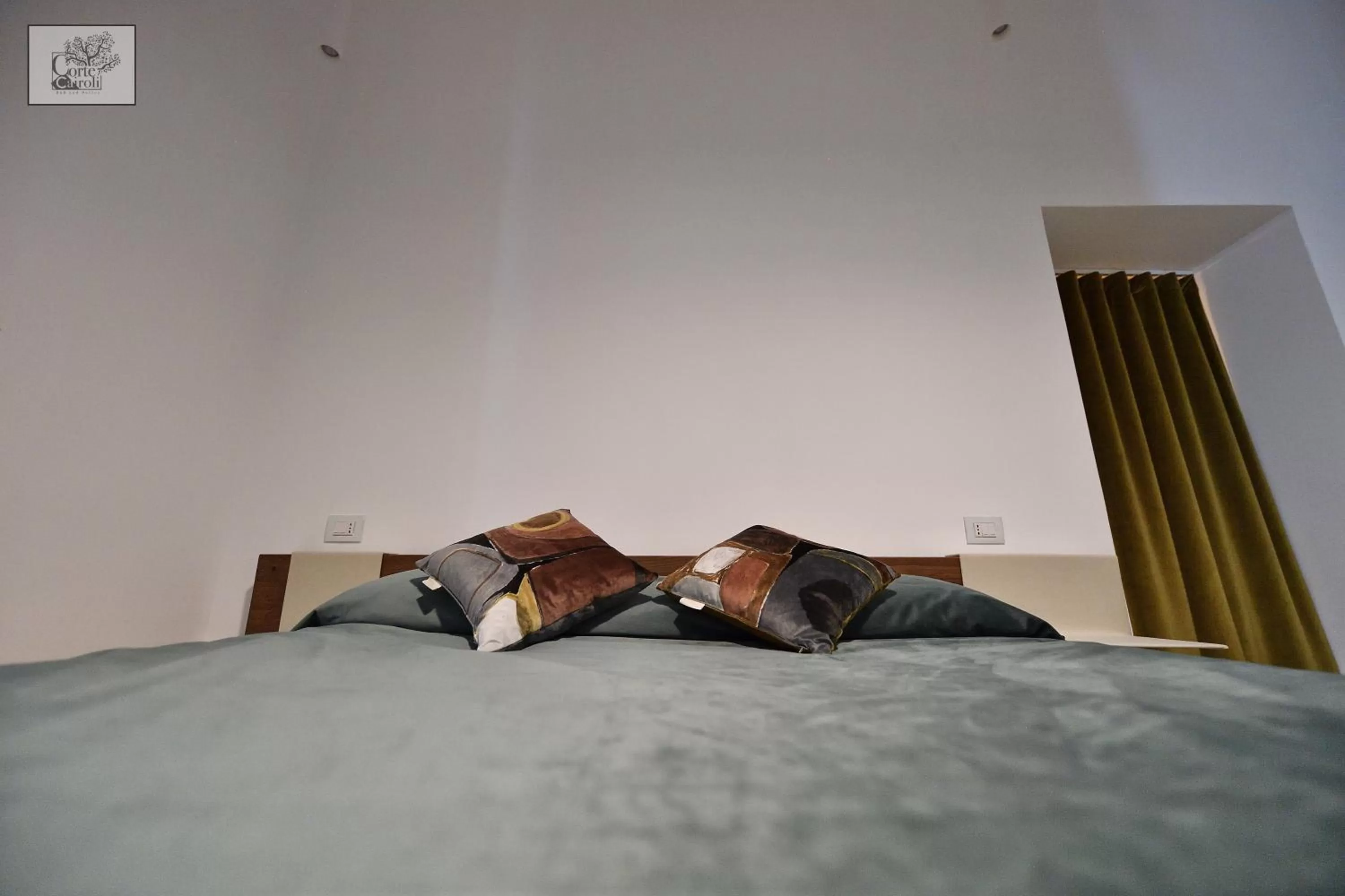 Bed in Corte Cairoli B&B and Suites