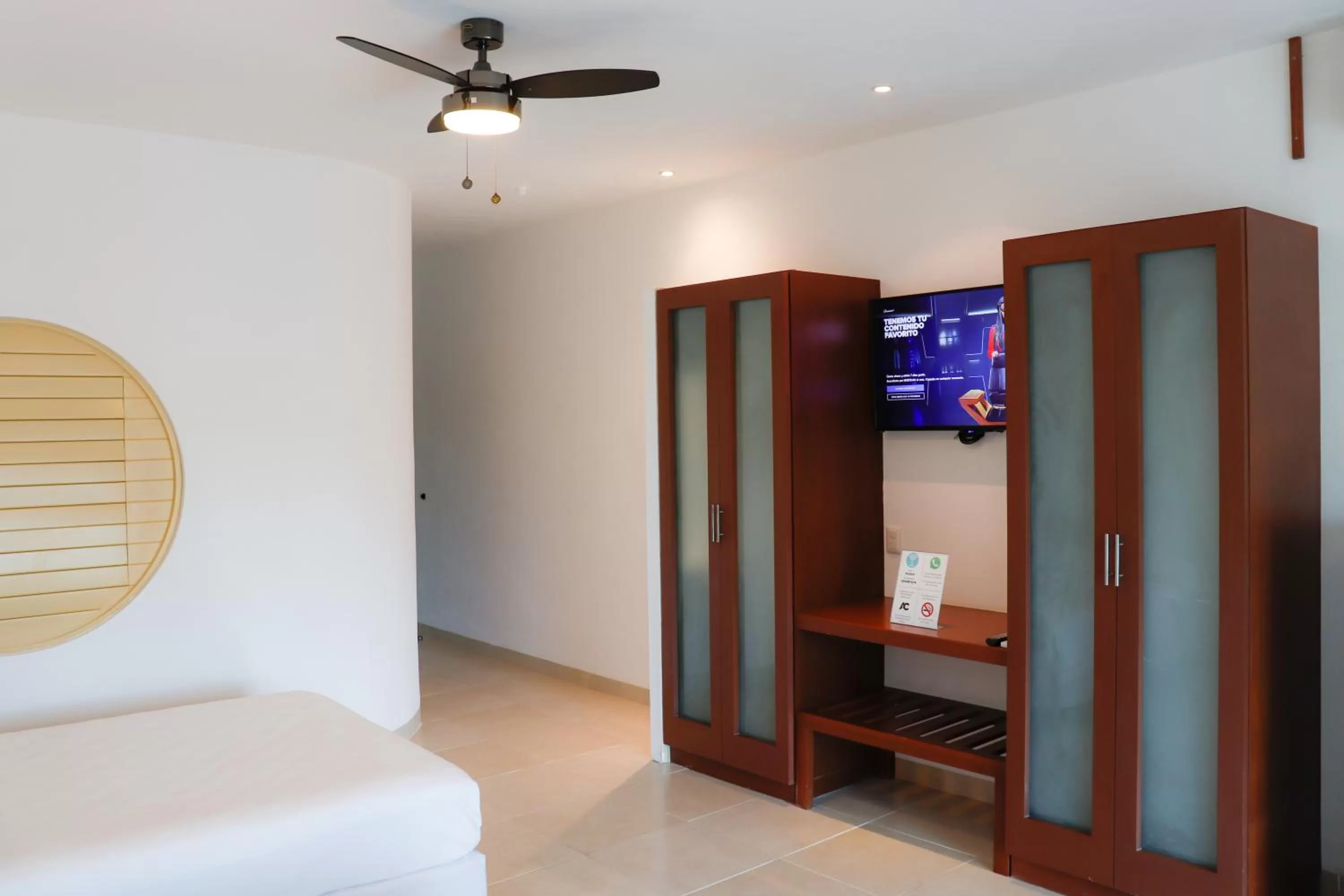 Photo of the whole room, TV/Entertainment Center in Maia Suites Cozumel