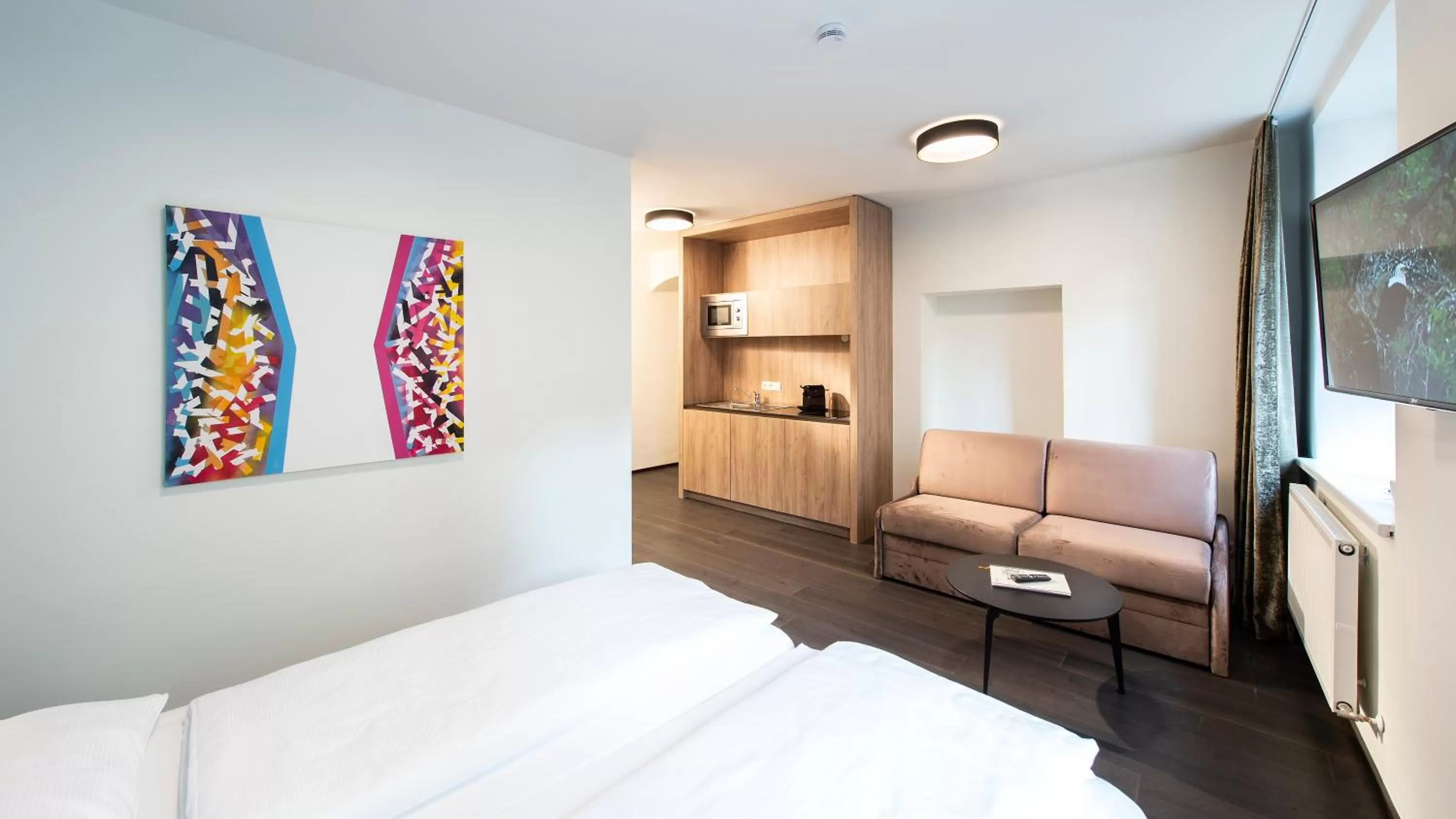 Seating area, Bed in Blackhome Innsbruck Boutique I contactless check-in