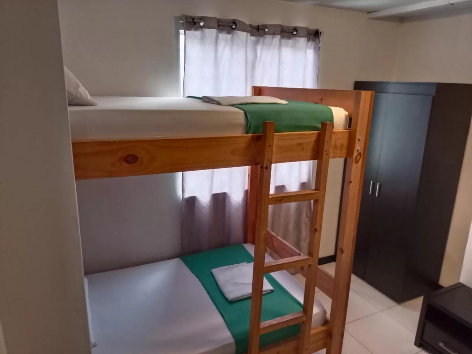 Bed in Apartasuites San Marcos