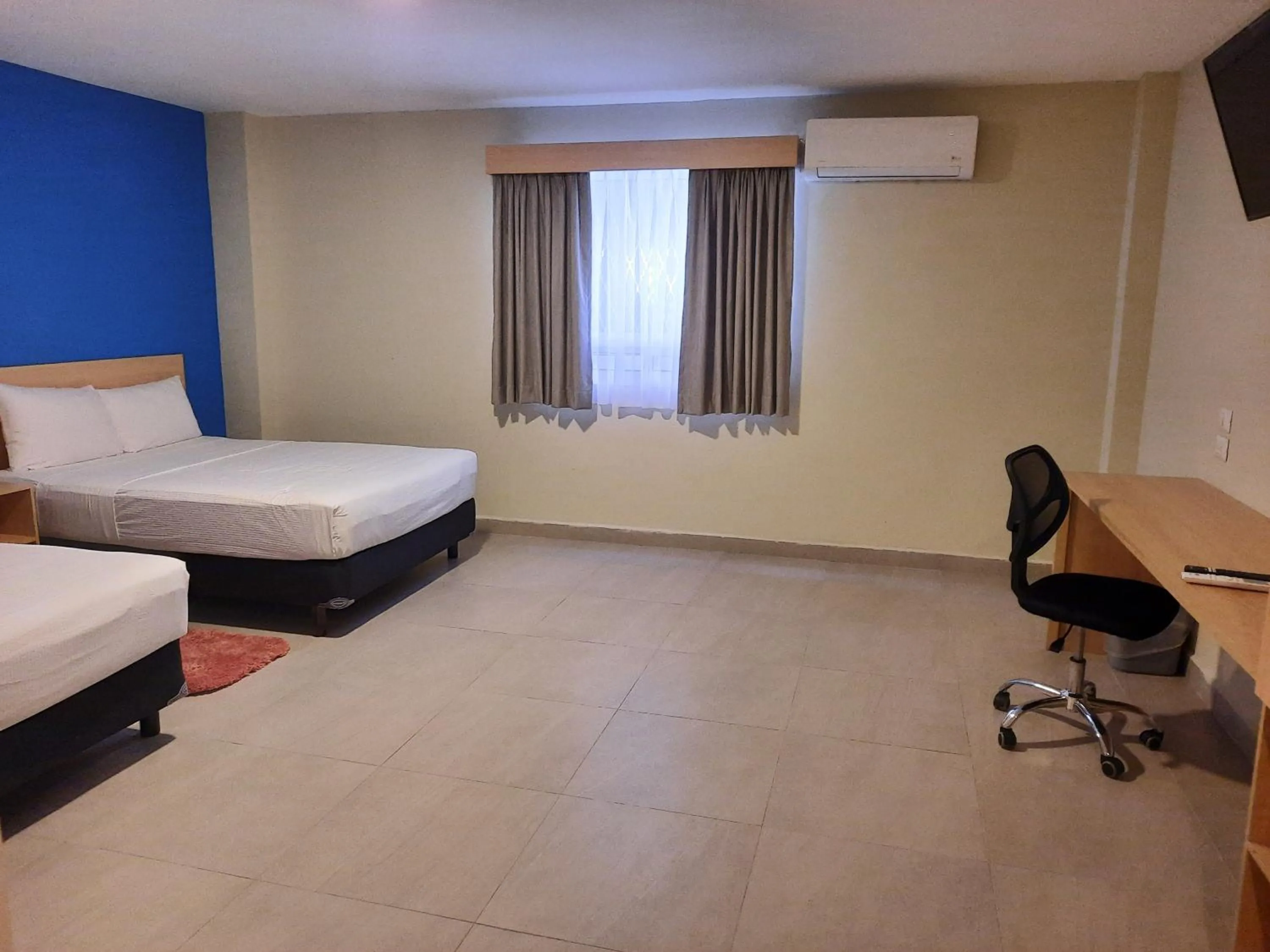 Bed in CHN Hotel Monterrey Santa Fe