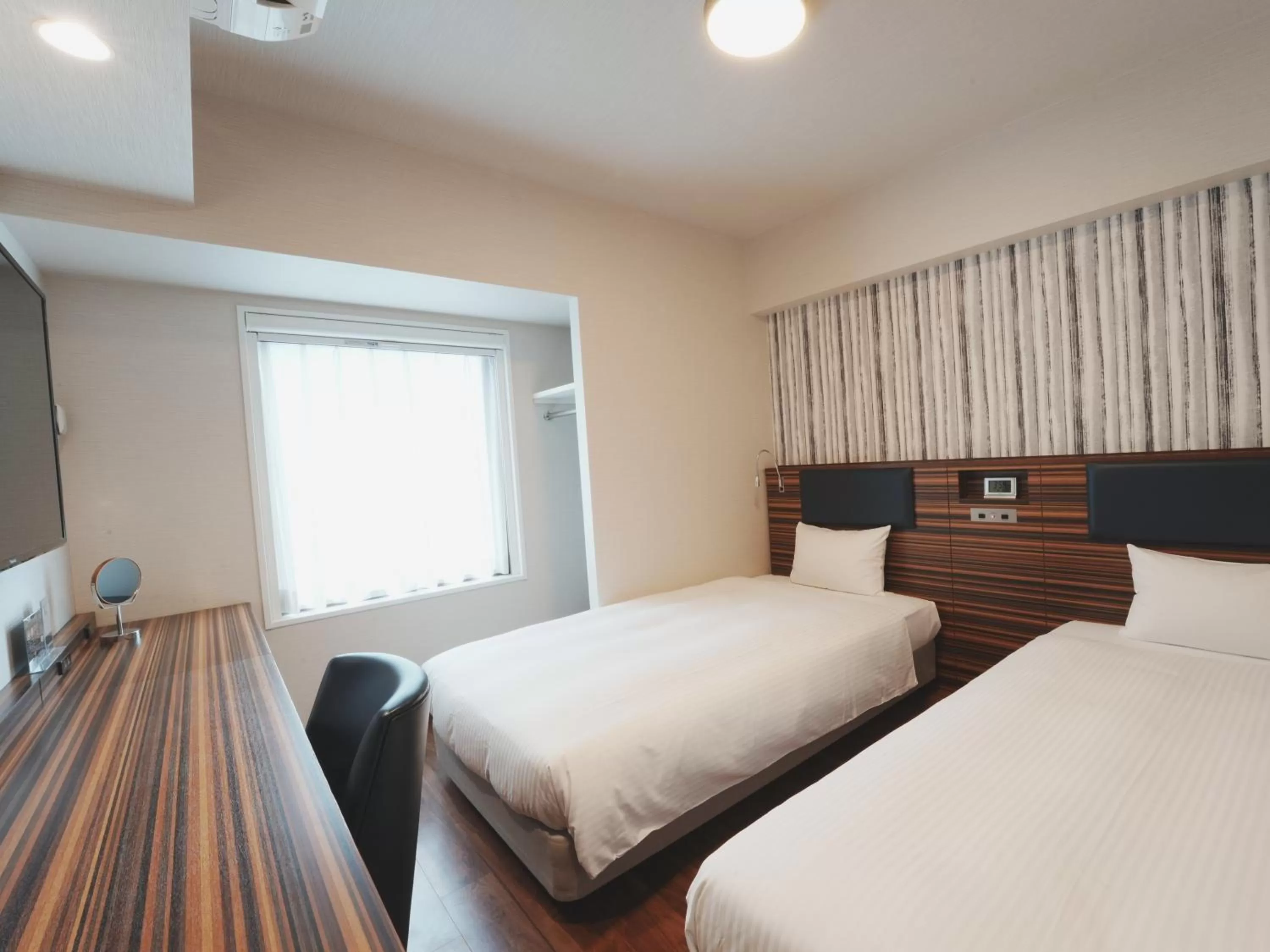 Photo of the whole room, Bed in The BREAKFAST HOTEL Fukuoka Nakasu