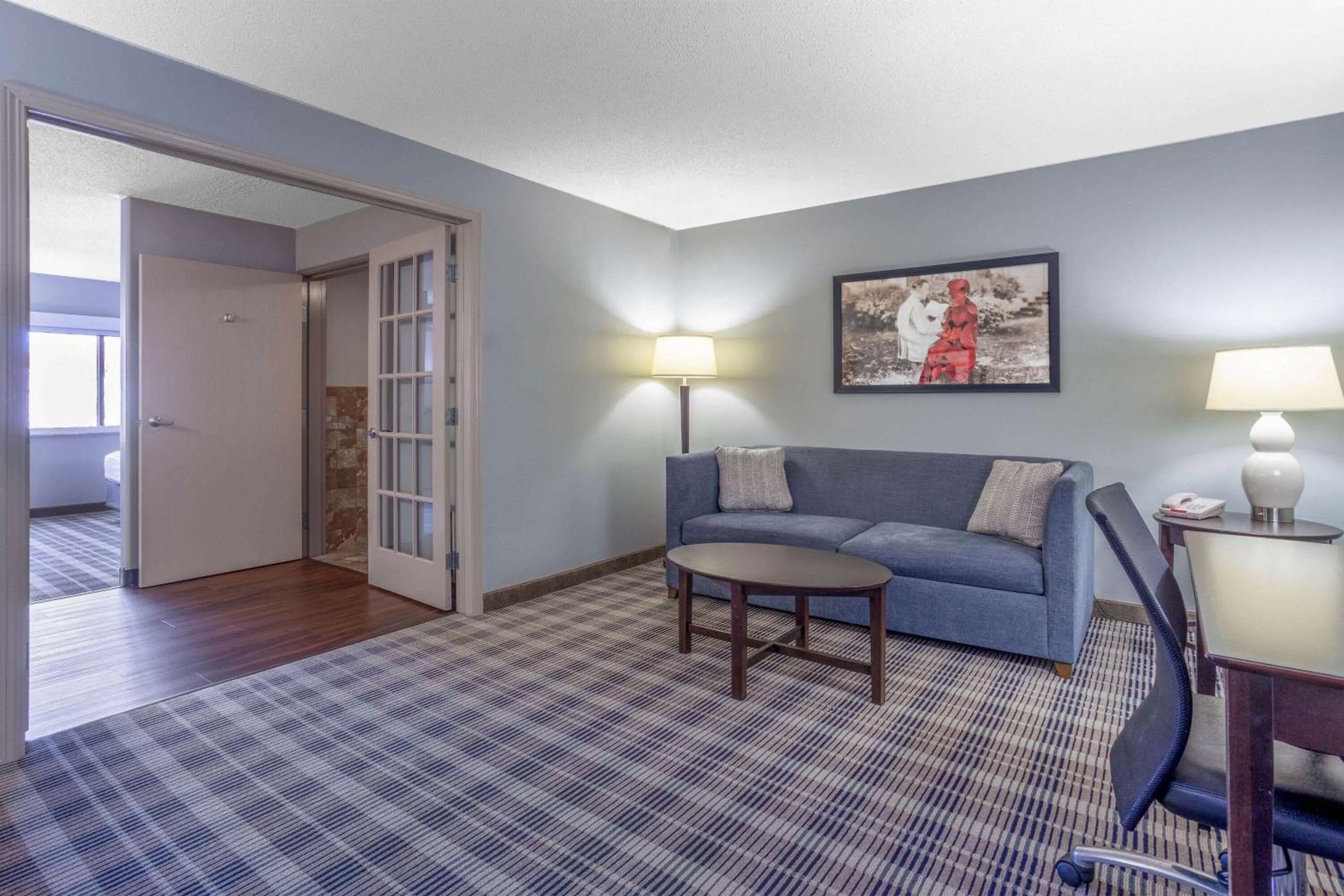 Bed in AmericInn by Wyndham Madison South