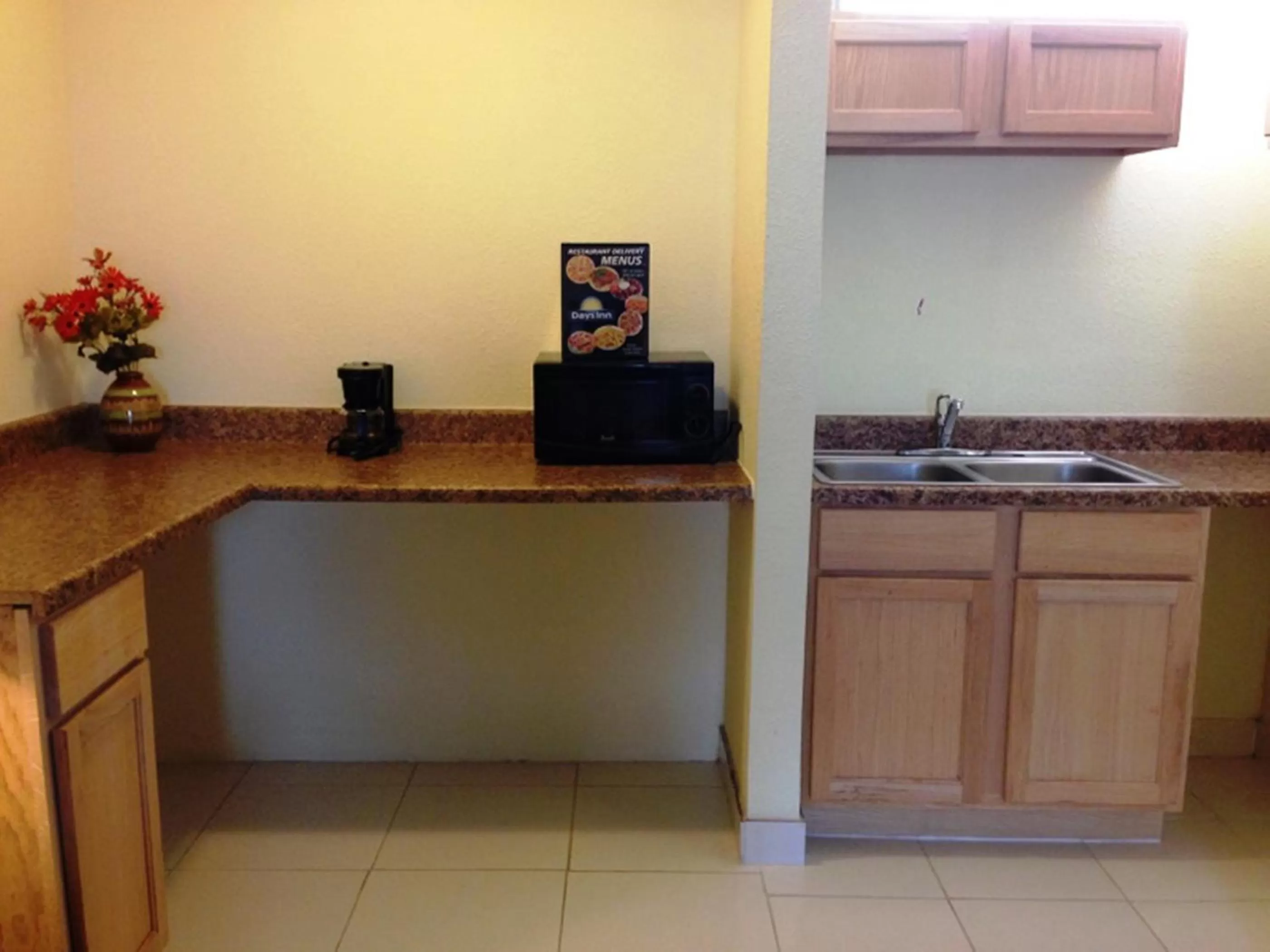 Kitchen or kitchenette in Days Inn by Wyndham Irving Grapevine DFW Airport North