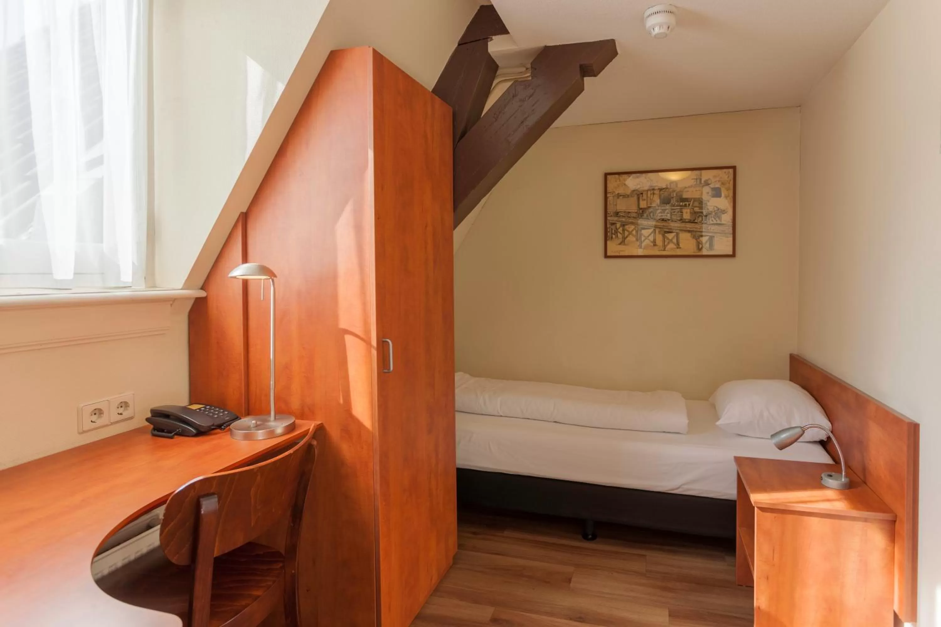 Bed in A-Train Hotel