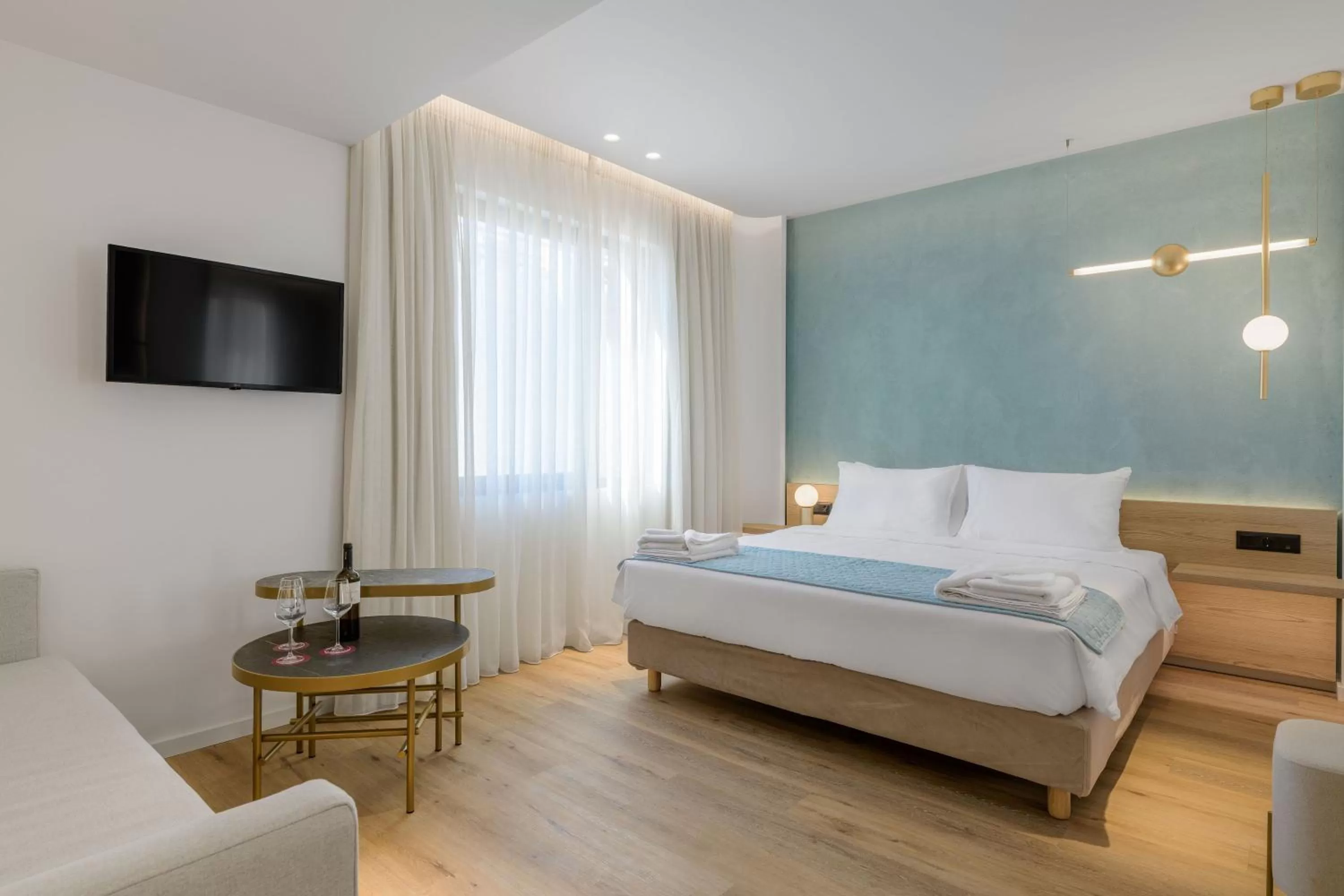 Bed in Acropolis Magenta Luxury Suites