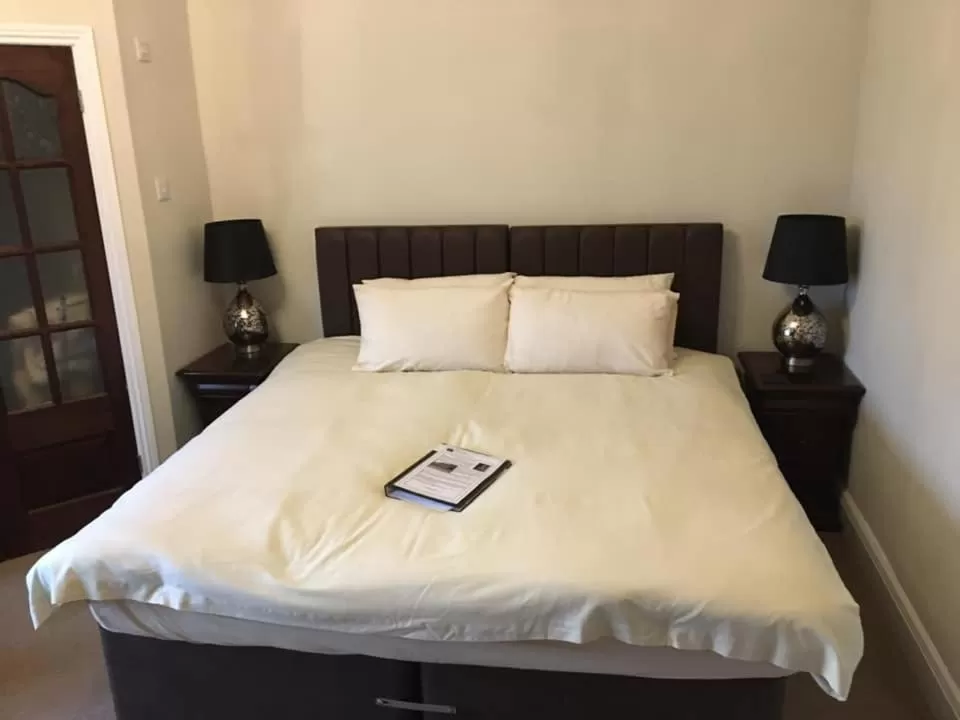 Bed in Brass Castle Country House Accommodation