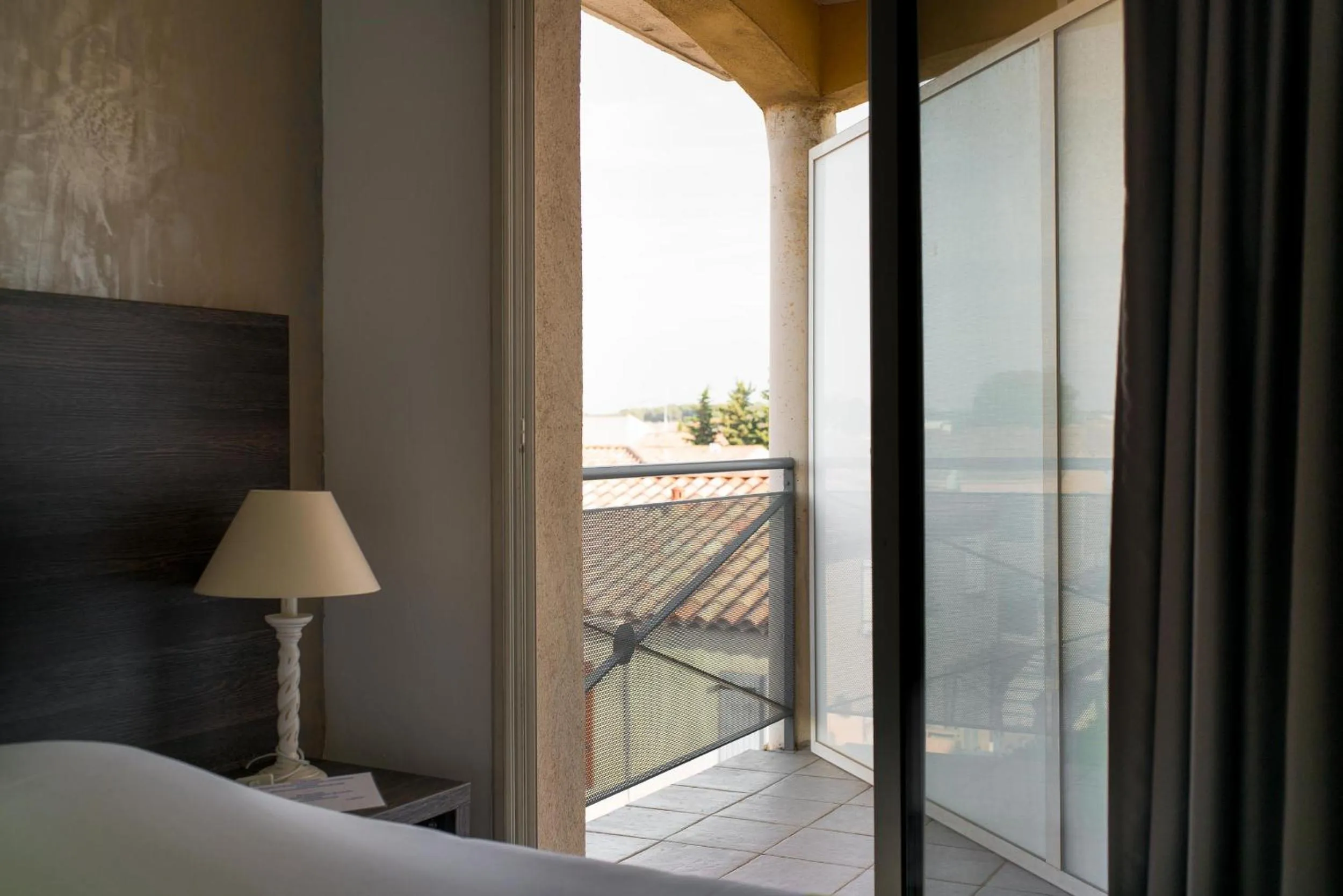 Balcony/Terrace, Bed in Hôtel Ariane