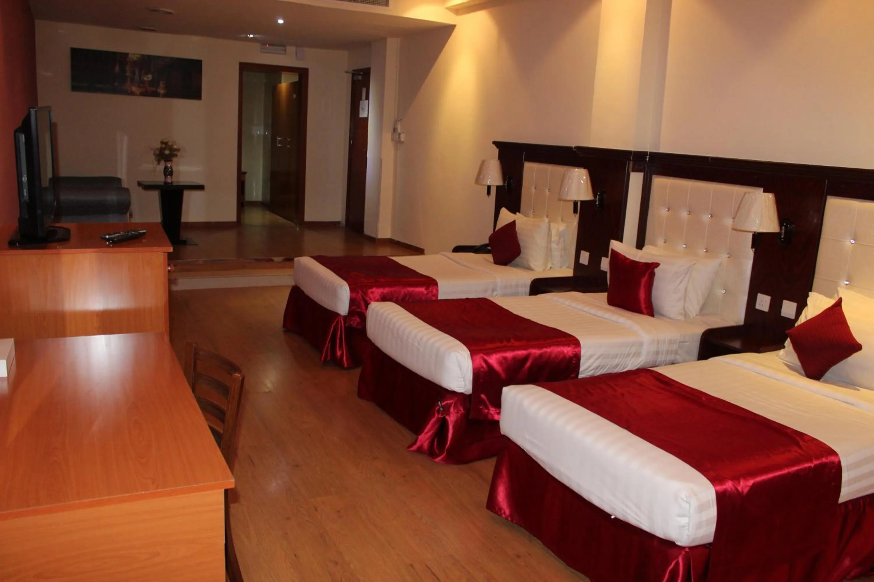 Bed in Grand Nova Hotel