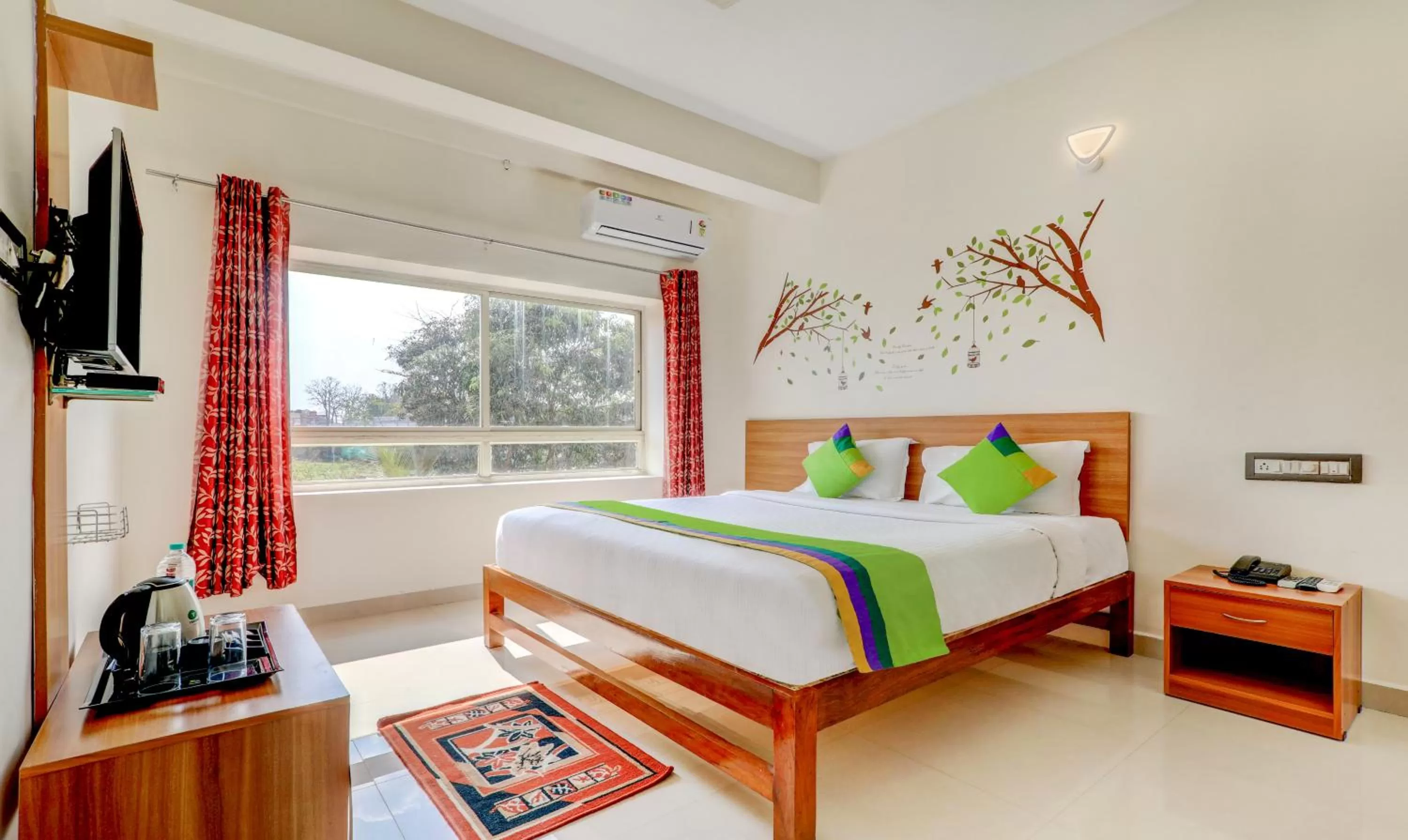 Bedroom, Bed in Treebo Atithi Comforts, 1 Km From Nisargadhama Forest